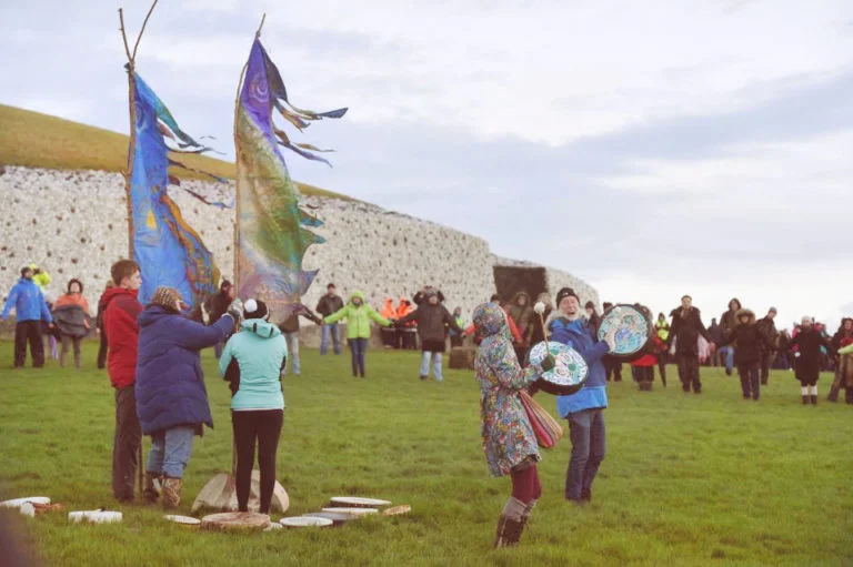 newgrange-circle-holding-hands-fun-celebration-masculine-feminine-flag-louse-declan-rainbowbridge-corporate-wellness-ireland-768x511.jpg