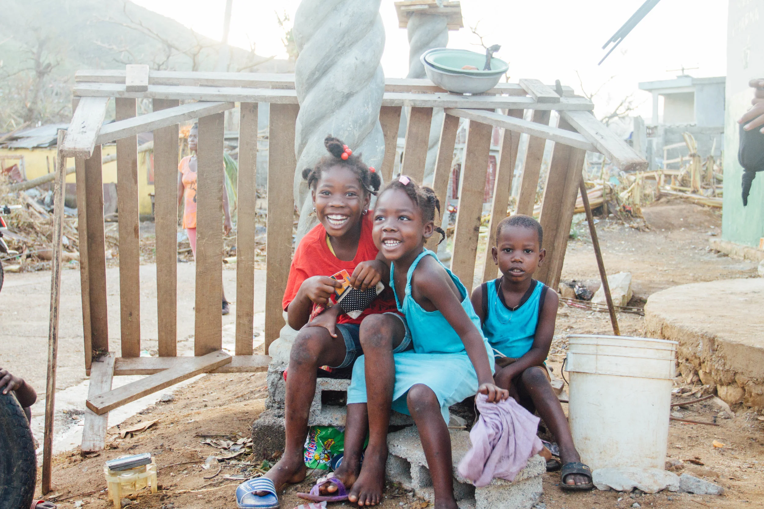 October 10th - R E S I L I E N T. When people ask me about the Haitian people, that's the first word that comes to my mind. It's truly beautiful to see their resilience & strength. Would you please continue to pray for these people & support relief going to those who have endured so much suffering? The relief efforts are only just beginning. There is so much devastation to overcome. As we walked through this village at sunrise, these joyful little beauties were yet another reminder that the darkness WILL NOT drive out the light."