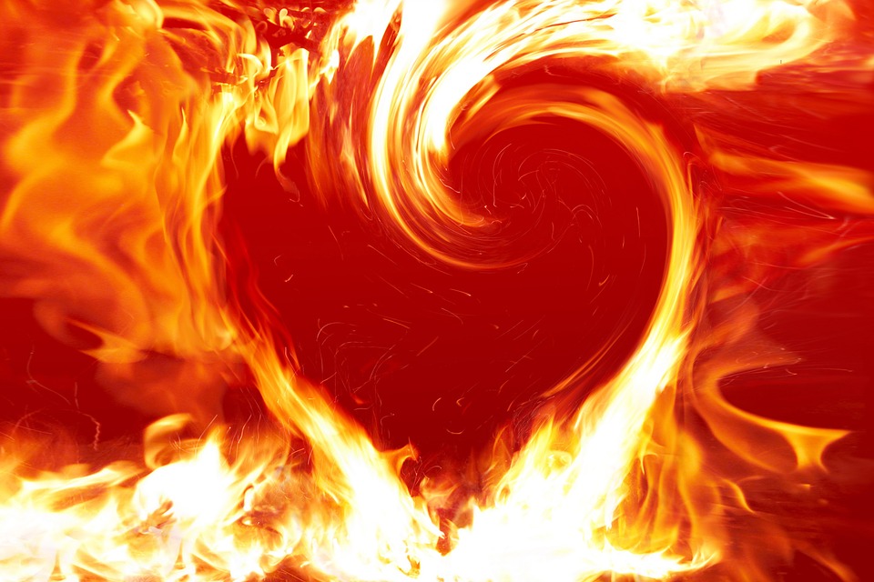 Heart shaped fire flames isolated on black background. 3D illustration. Fire  heart on a dark background, AI Generated 25500848 Stock Photo at Vecteezy