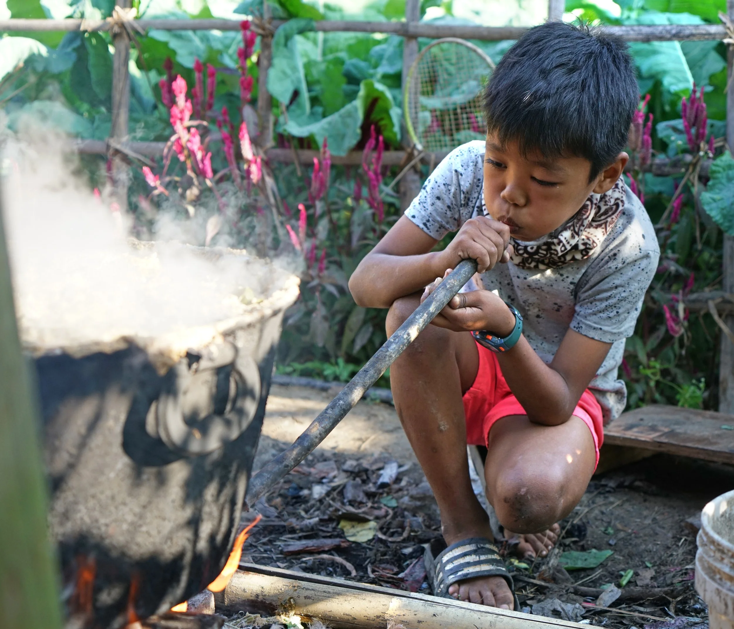 Assis blowing smoke smaller.jpg