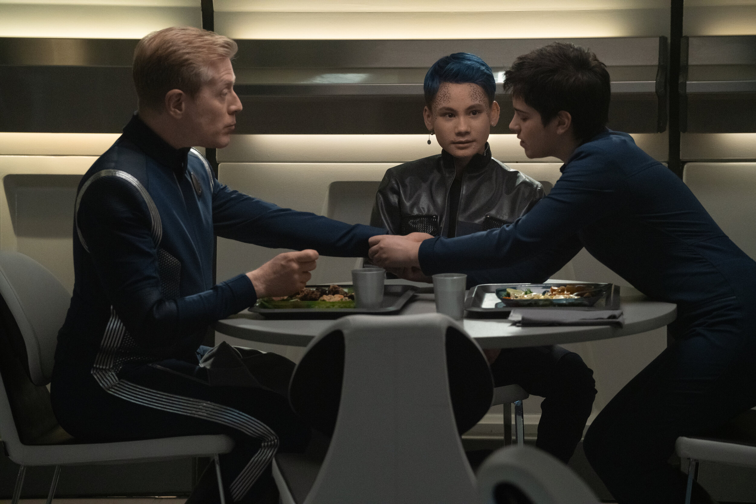   "Scavengers" -- Ep#306 -- Pictured: Anthony Rapp as Lt. Paul Stamets, Ian Alexander as Gray and Blu del Barrio as Adira of the CBS All Access series STAR TREK: DISCOVERY. Photo Cr: Michael Gibson/CBS ©2020 CBS Interactive, Inc. All Rights Reserved.