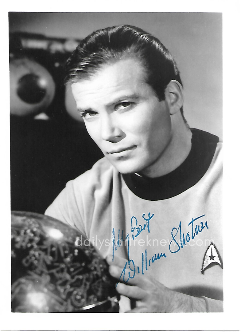   William Shatner as Captain Kirk in an autographed promotional photo from Star Trek  