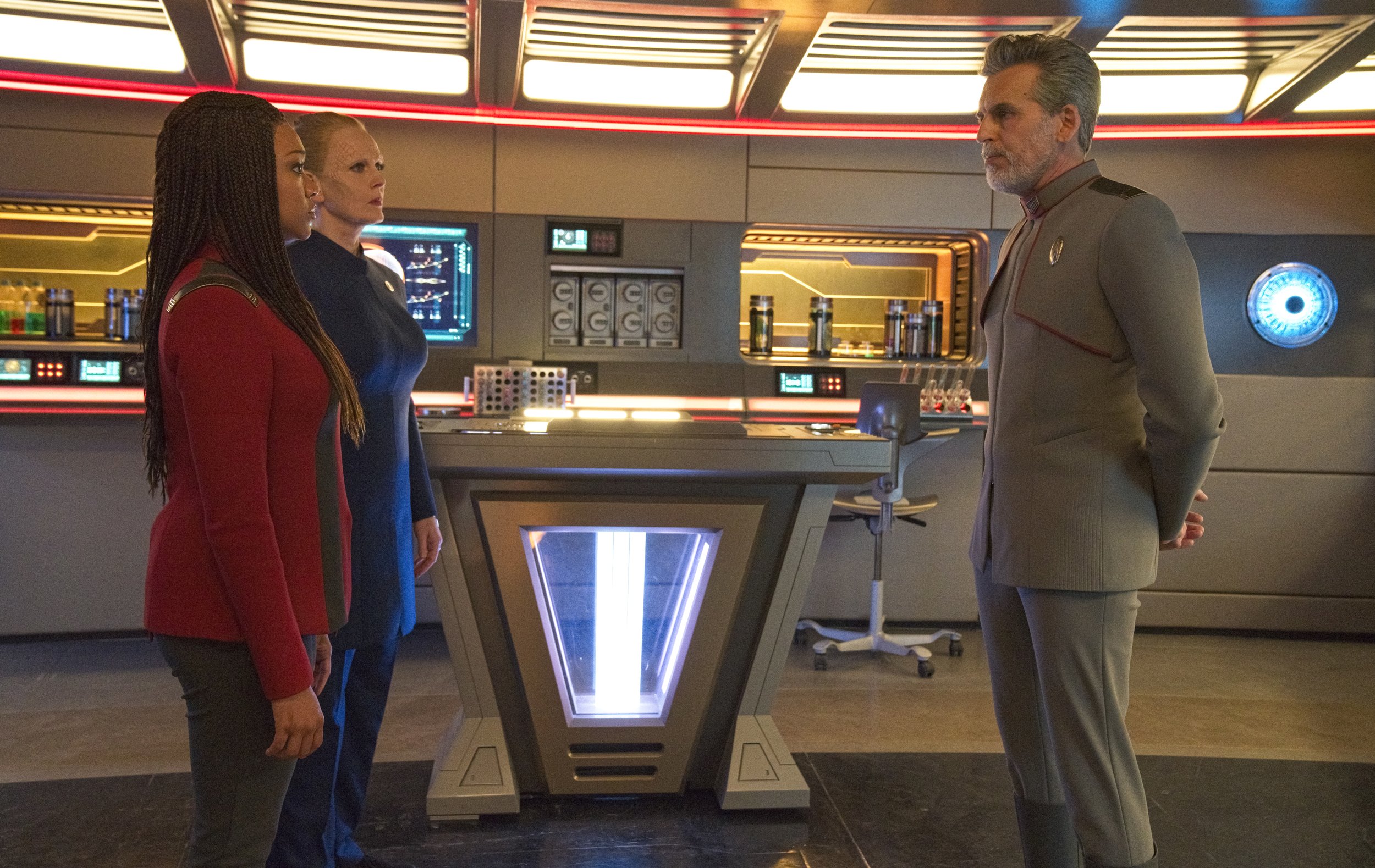   Pictured: Sonequa Martin Green as Burnham, Chelah Horsdal as President Laira Rillak and Oded Fehr as Admiral Vance of the Paramount+ original series STAR TREK: DISCOVERY. Photo Cr: Michael Gibson/Paramount+ (C) 2021 CBS Interactive. All Rights Rese