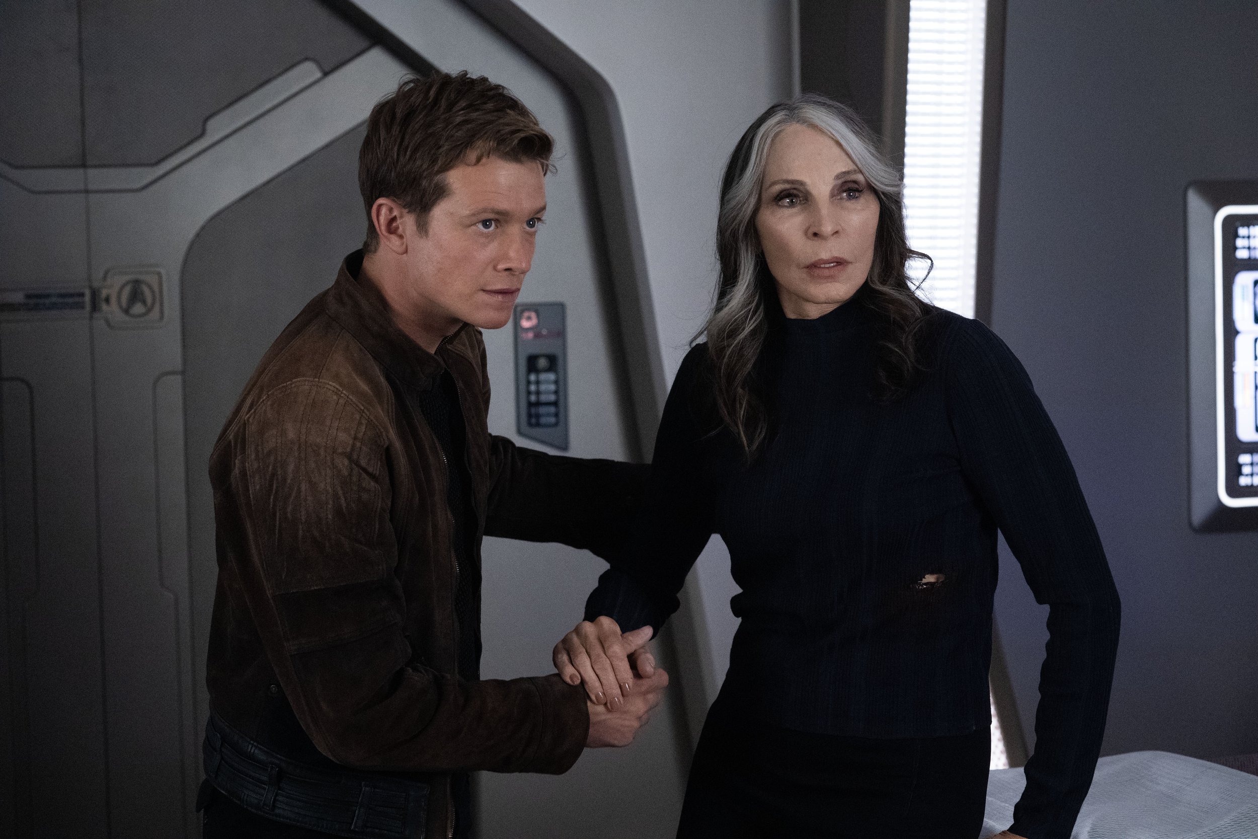   Ed Speleers  as Jack Crusher and  Gates McFadden  as Dr. Beverly Crusher.  Photo Credit: Monty Brinton/Paramount+.  