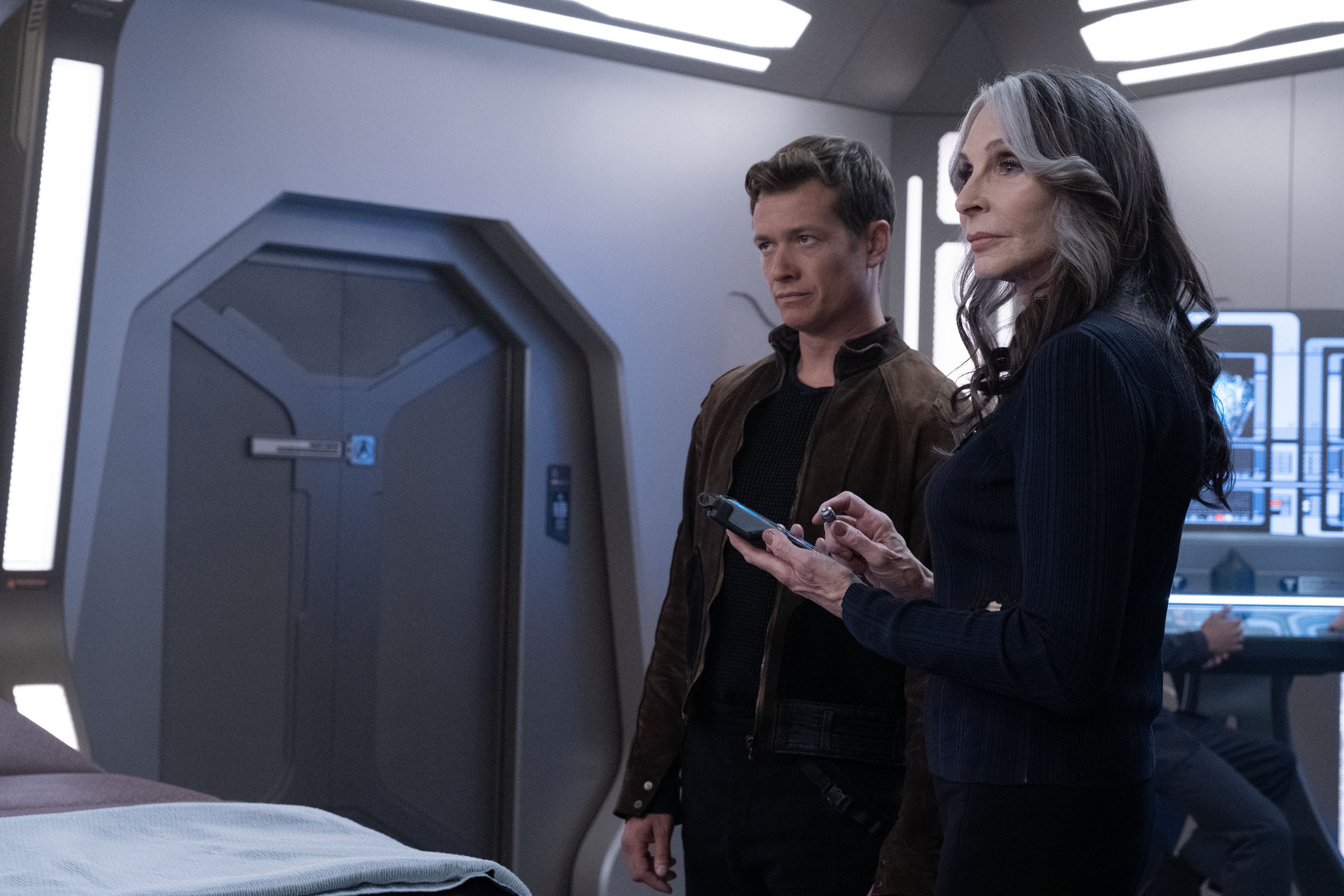   Ed Speleers  as Jack Crusher and  Gates McFadden  as Dr. Beverly Crusher.  Photo Credit: Trae Patton/Paramount+.  