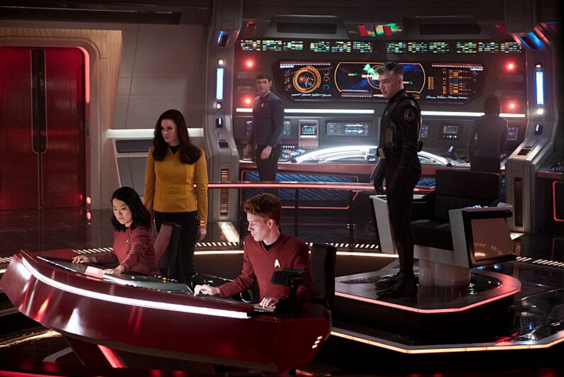   Rong Fu  as Mitchell,  Rebecca Romijn  as Una,  Ethan Peck  as Spock and  Anson Mount  as Capt. Pike. Photo Credit: Michael Gibson/Paramount+ 