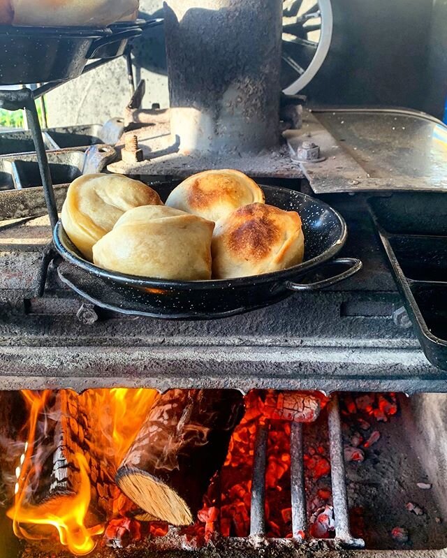 Empanadas filled with either cheesy goodness or some delicioso grass fed beef are fresh out of the oven and staying warm over the fire at the @motuekasunday today. She&rsquo;s a bit chilly and grey out there, but our fire is on and the food is hot! C