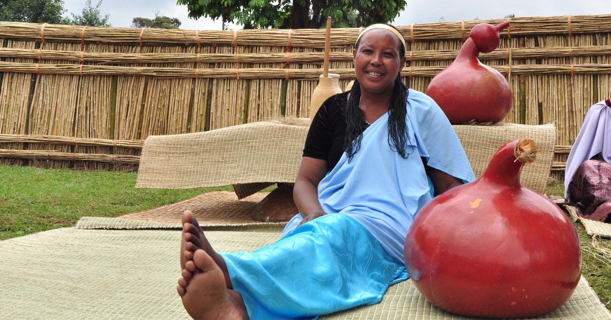 Woman holding calabash for butter making