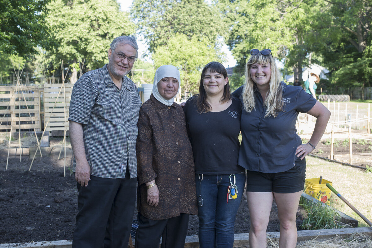  Community members of the Sheridan neighborhood including Imam Dr. Hamdy El-Sawaf (left), Hilari Bandow (second from right), and Hilary Hazzard (right) came together to make SNO Community Garden a reality // Photo by Max Lee, 2017 