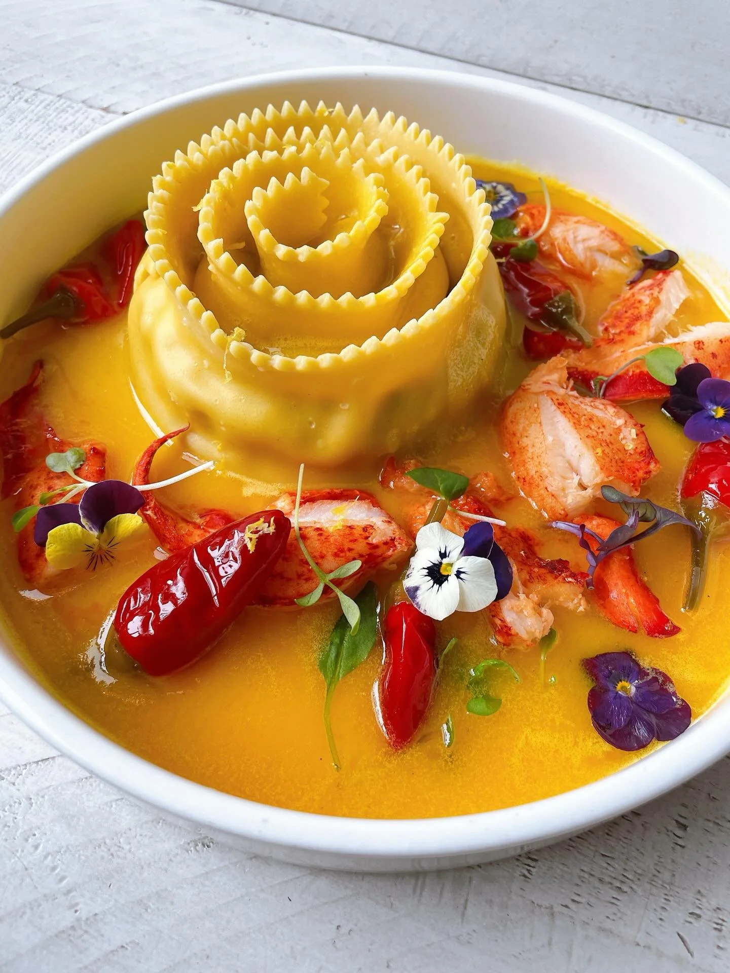 Our lobster pinwheel agnolotti with Maine lobster, saffron beurre blanc, calabrian chile, lemon zest 🦞