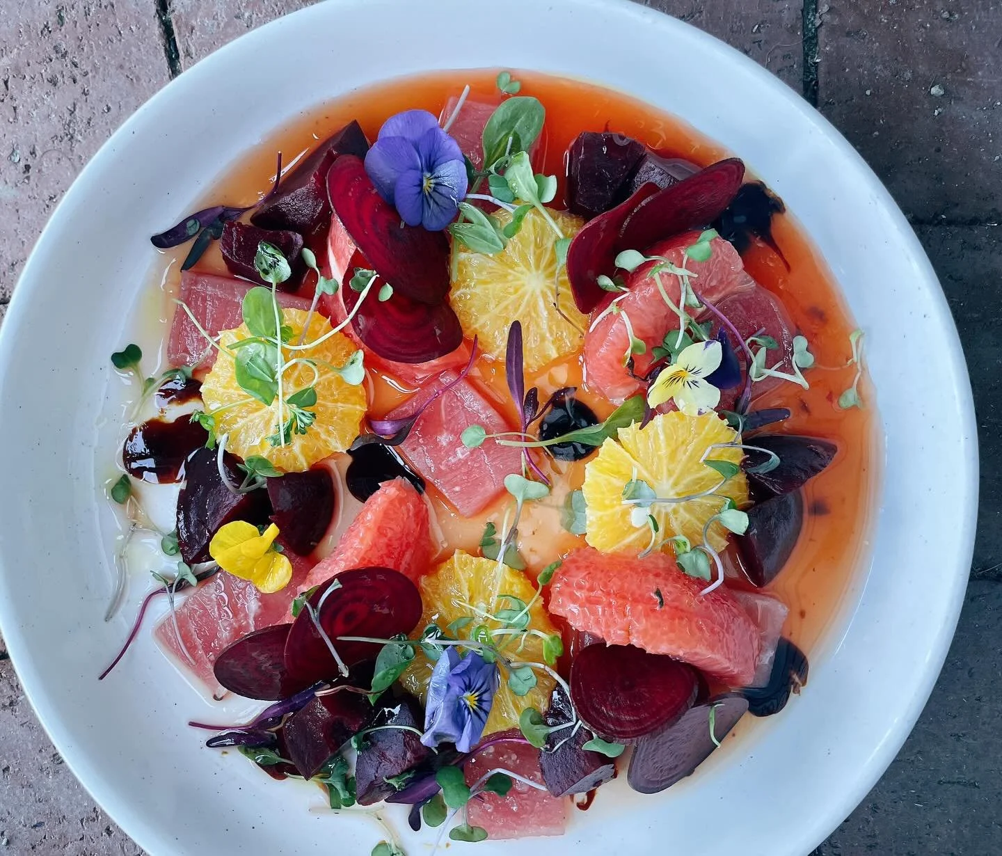 Our ahi tuna crudo with roasted and shaved beets, orange, grapefruit, blood orange gastrique, balsamic reduction, EVOO, pink Himalayan sea salt