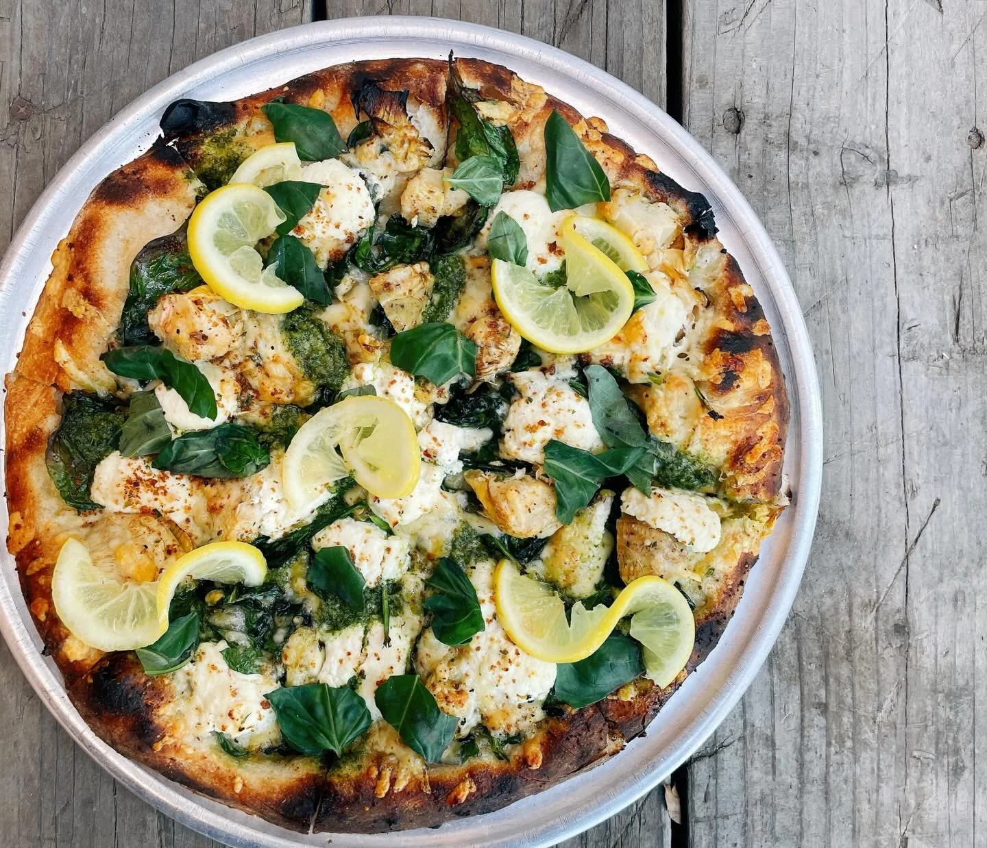 Okey dokey artichokey! With garlic oil base, grilled artichokes, spinach, basil pesto, lemon ricotta, fontina, breadcrumbs, pickled lemons. 
.
Ordering take-out is super easy with us! Just text us your order at 970-319-5118. No awkward phone calls, n