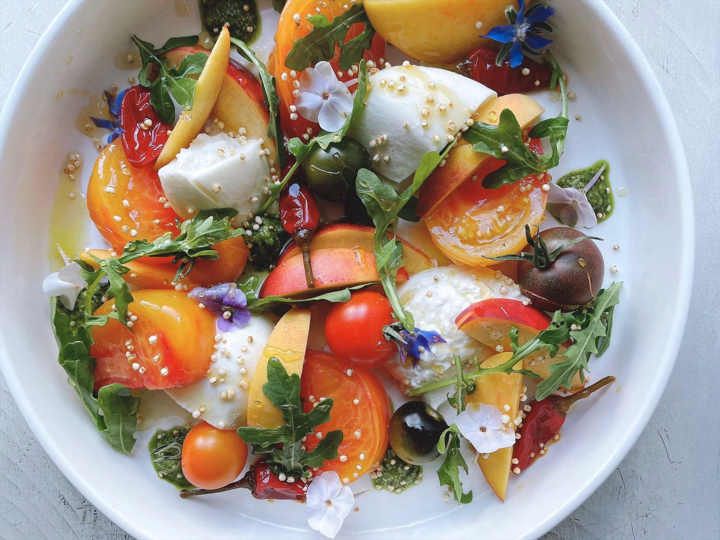 We&rsquo;ve been seeing some leaves change, but our hours are not! We&rsquo;re still open every night (except Tuesdays) for dinner. Stop on by!
.
Burrata with heirloom and cherry tomatoes, peaches, nectarines, calabrian chile, arugula, puffed quinoa,