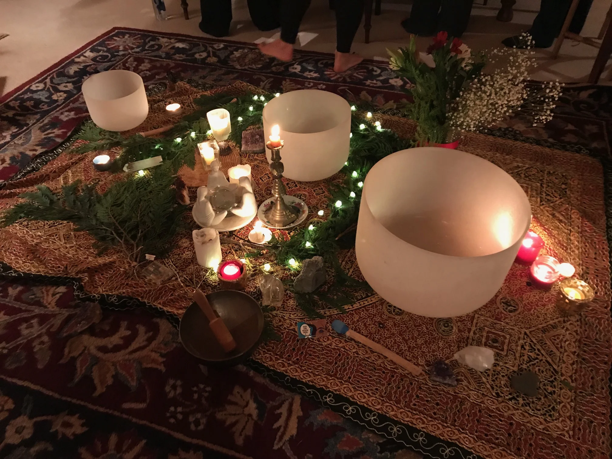 Winter Solstice gathering with crystal bowls in the central altar. Contact Margot to learn more about Equinox and Solstice gatherings.