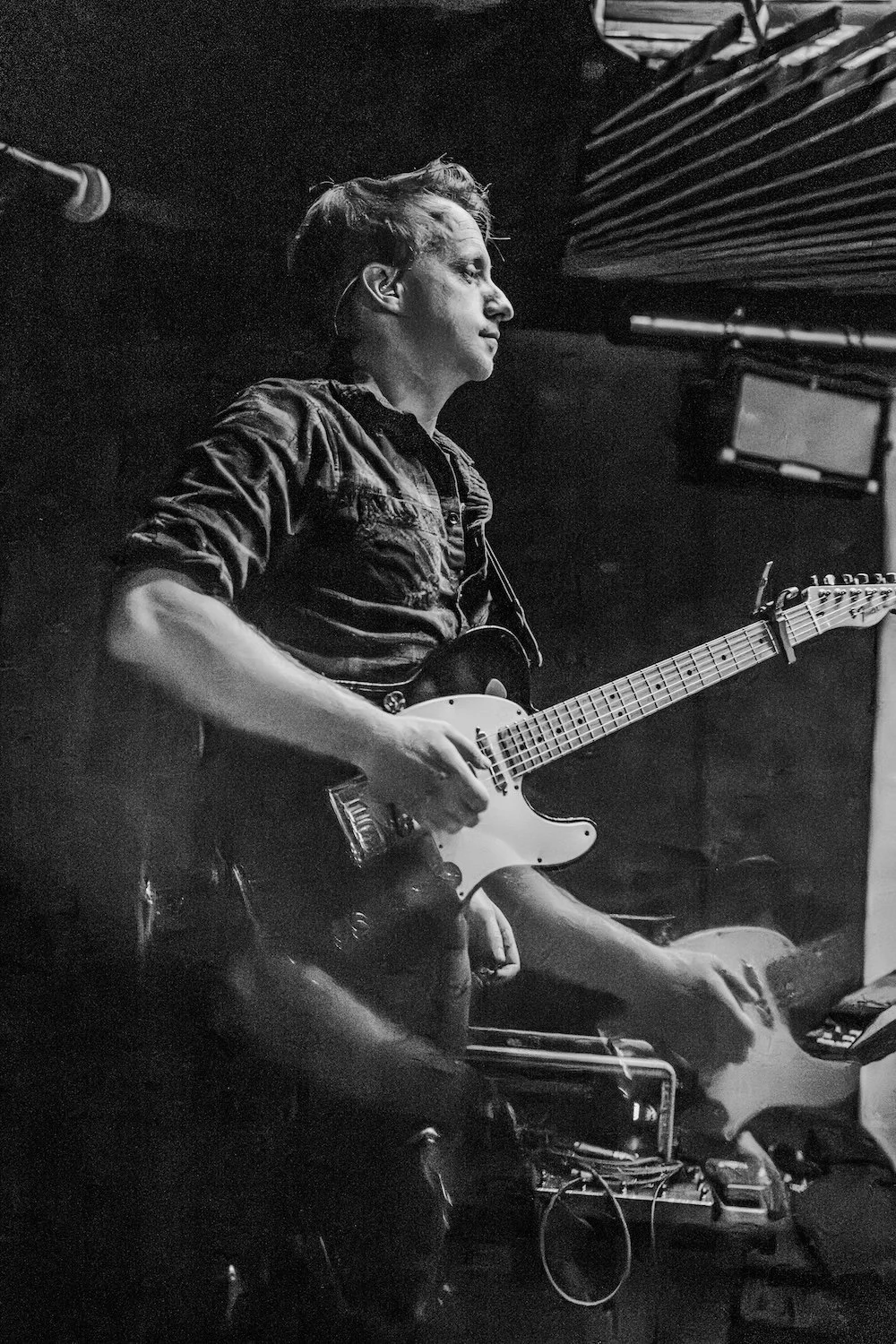 Brian Loeper of Elyse Therose plays guitar at Bar 404 in Denver, Colorado on February 27, 2026