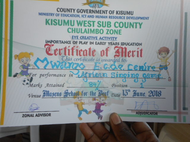 A certificate of merit for Mwanzo ECD winning 'African singing game' in 2018