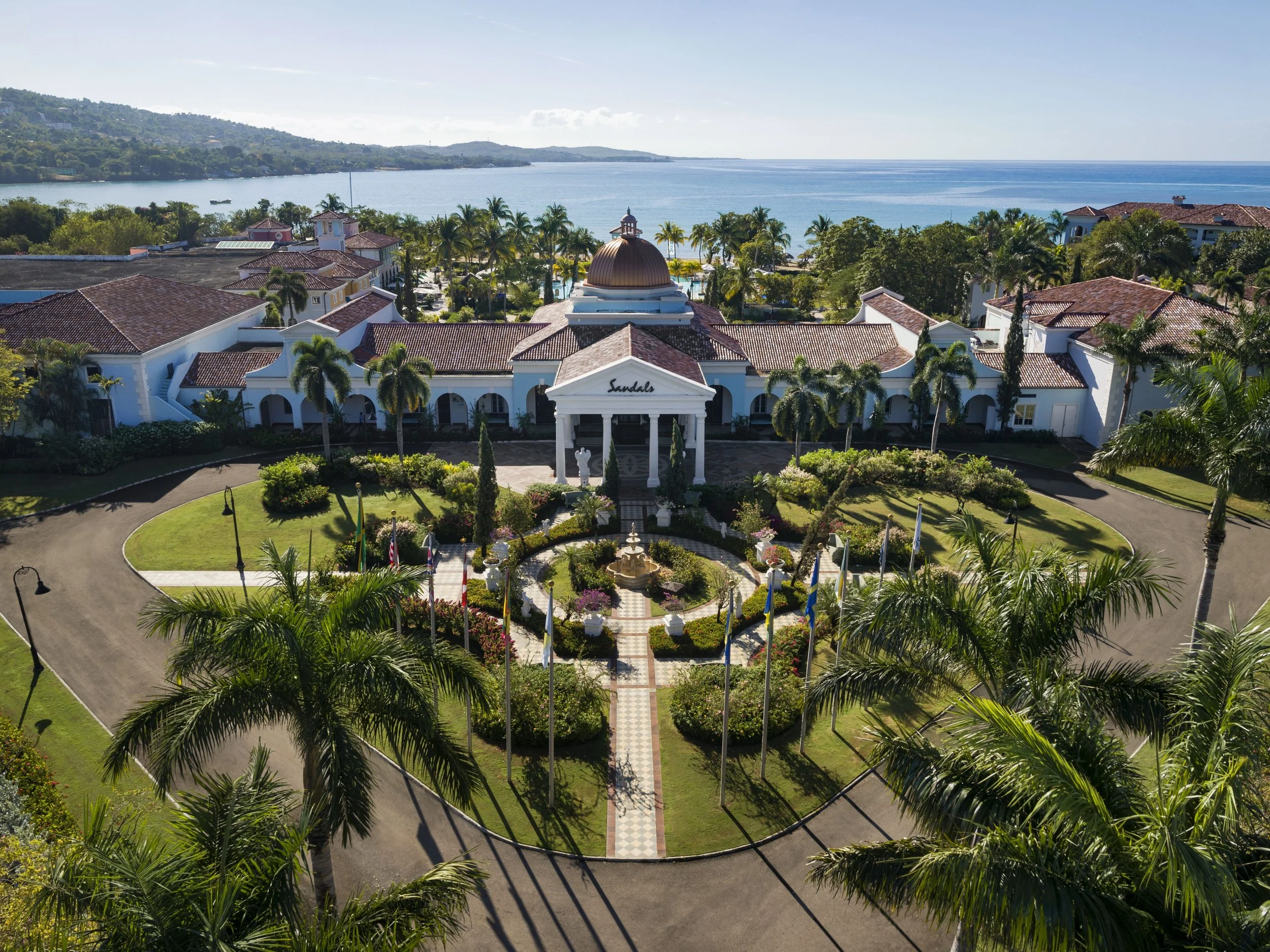 Travel Advisor Asset-SSC-Drone-Entrance-Garden-Ocean.jpg