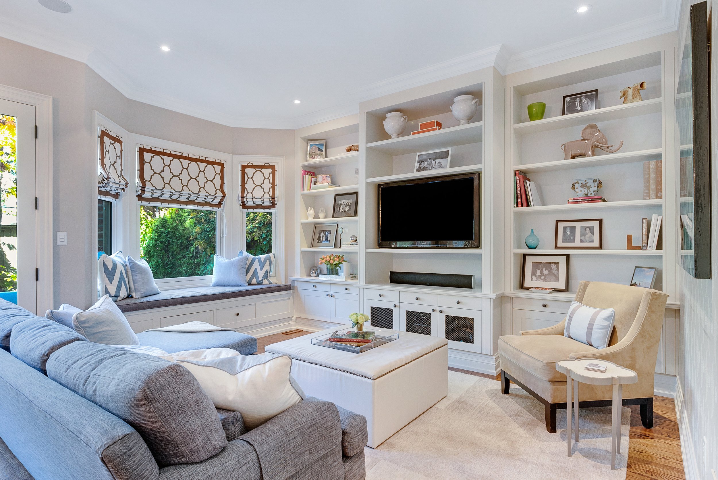  Living room with built in bookshelves and window bench. 