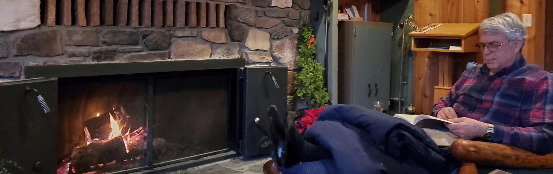 2023-01-Fr-Michael-Drury-by-Fireplace.gif