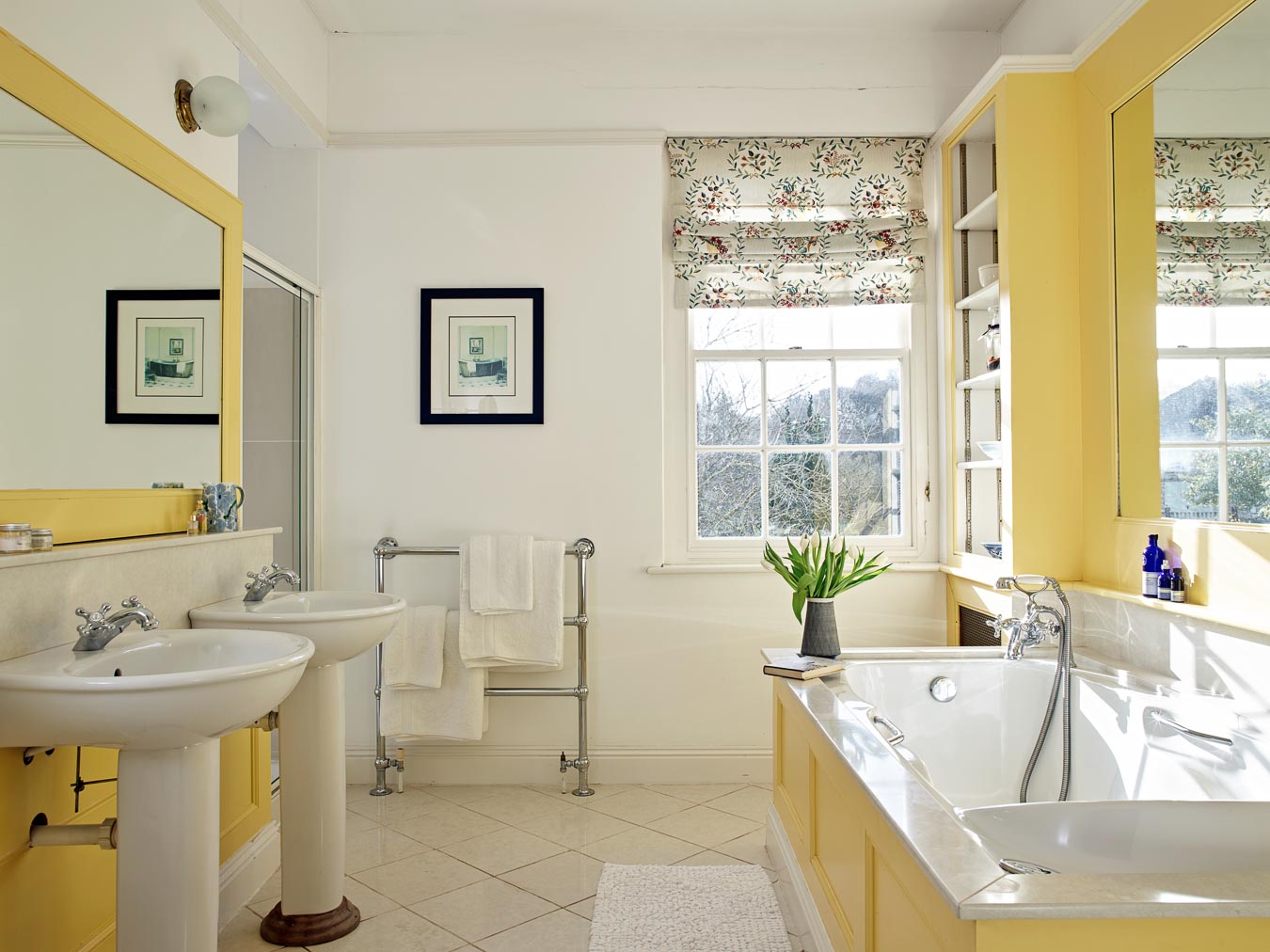 The bright master bathroom in Flear House with walk in shower, double sinks and jacuzzi bath.
