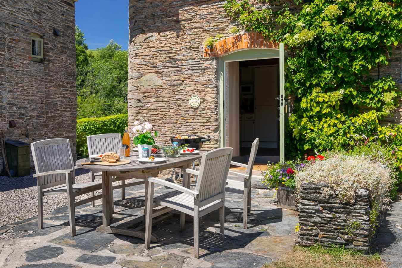 Alfresco dining on private patio outside Duck's Nest cottage Flear Farm. 