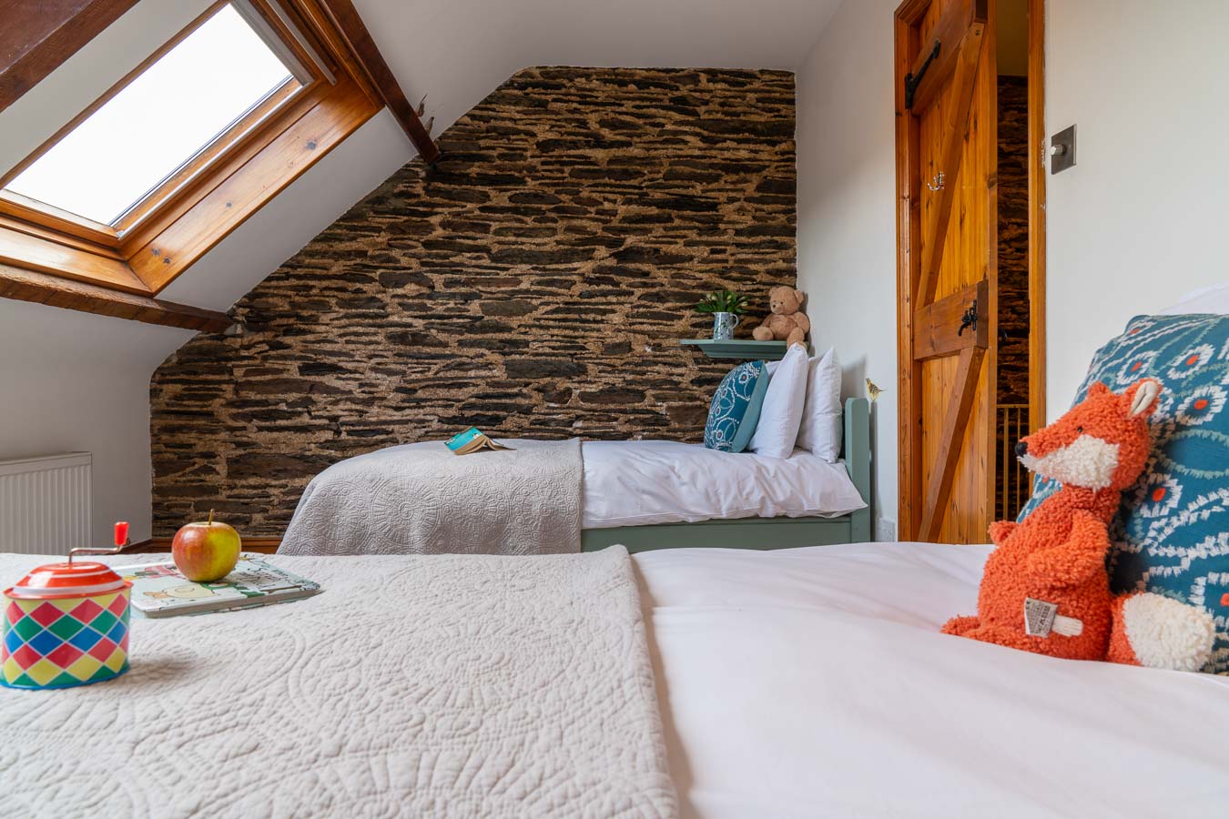 he twin bedroom with duck egg colour scheme and 100% Egyptian cotton bedding. Mangers Cottage, Flear Farm Holiday Cottages Devon.  