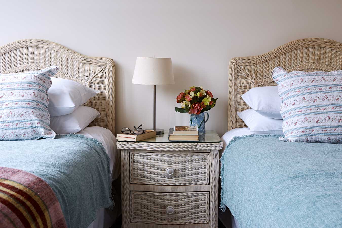 Orchard Lodge's twin room. Rattan style divan beds with 100% Egyptian cotton bedding. 