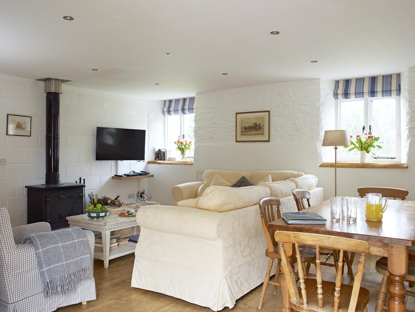 A log burning stove and comfortable sofa make this cottage perfect for all weathers. The Stables Cottage at Flear Farm. 