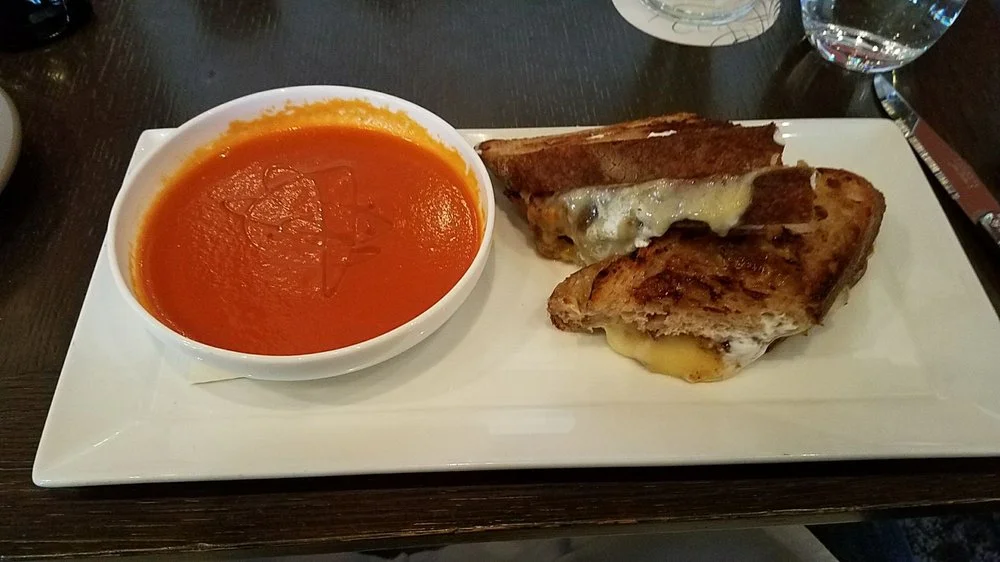 Three Cheese Blend, Tomato & Nectarine Salad, Smoked Tomato Vinaigrette. Photo via Yelp