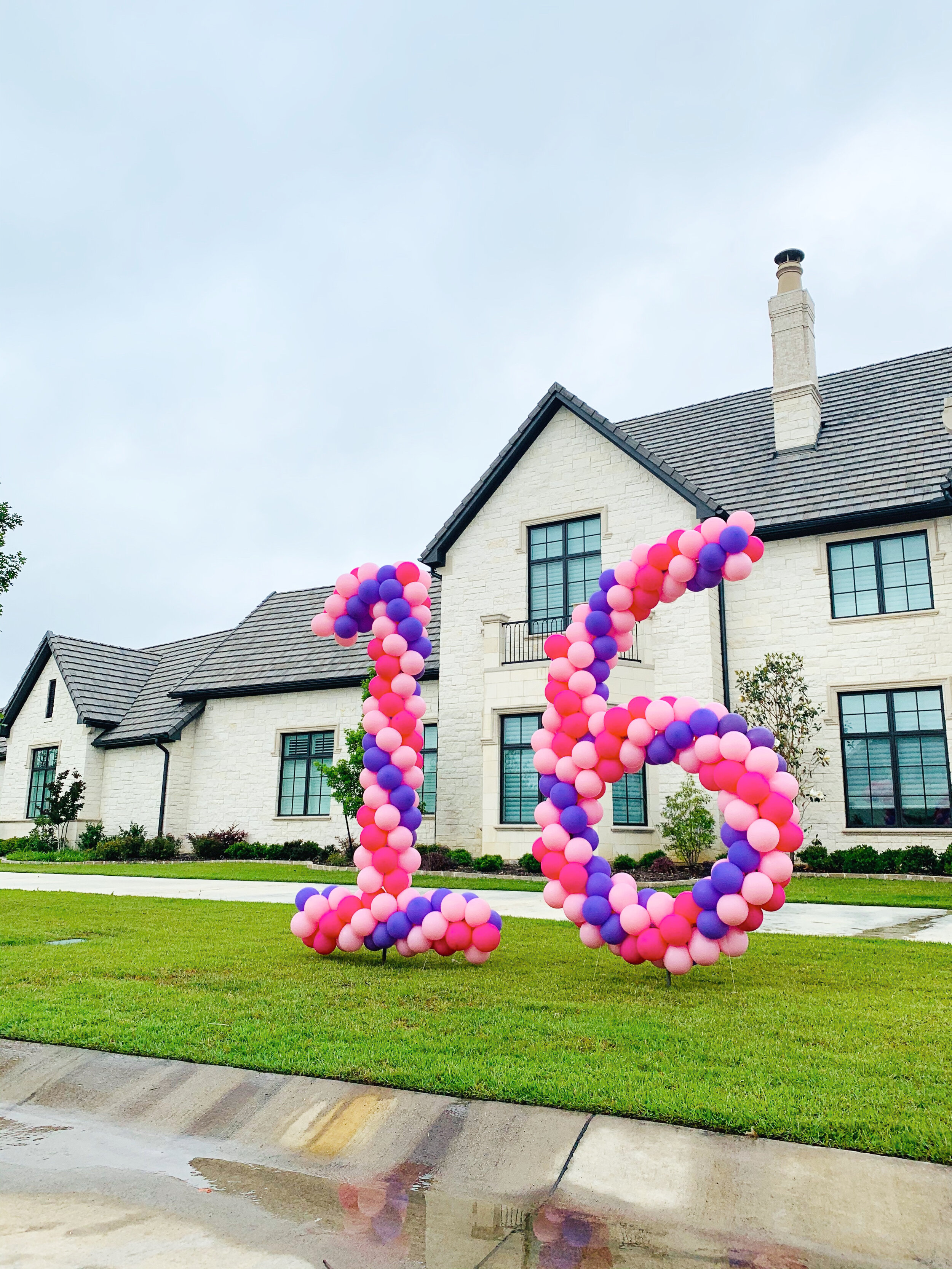  Yard balloon number in purples and pinks celebrating Sweet 16 in Southlake, Texas 
