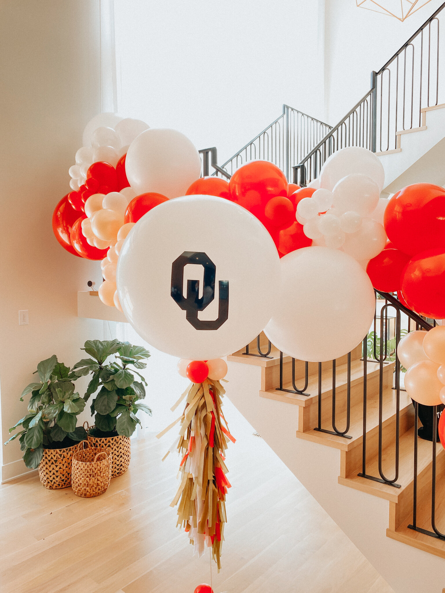  Organic balloon garland with OU Jumbo balloon and custom tassel 