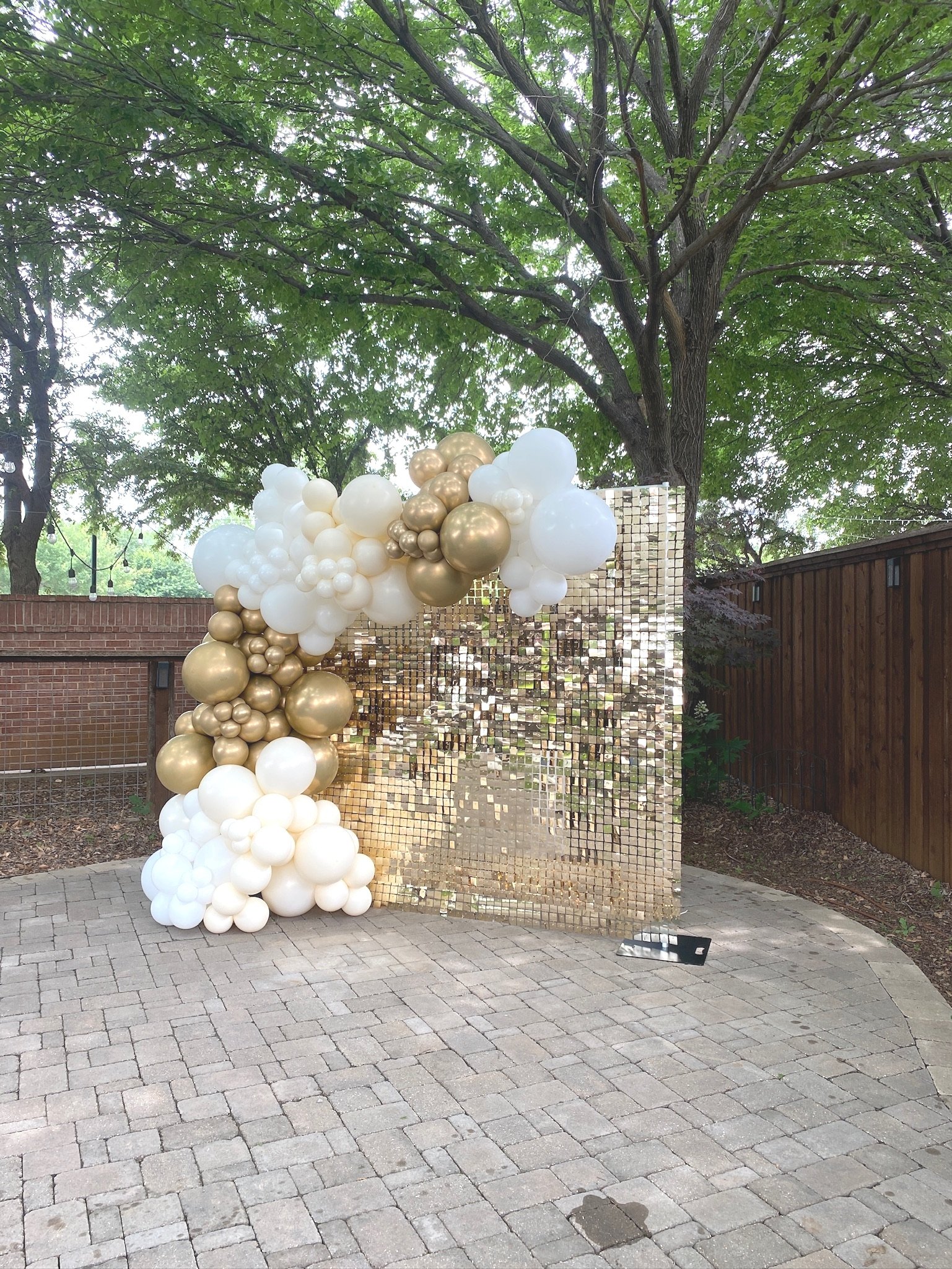 Elegant organic balloon arch on shimmer backdrop