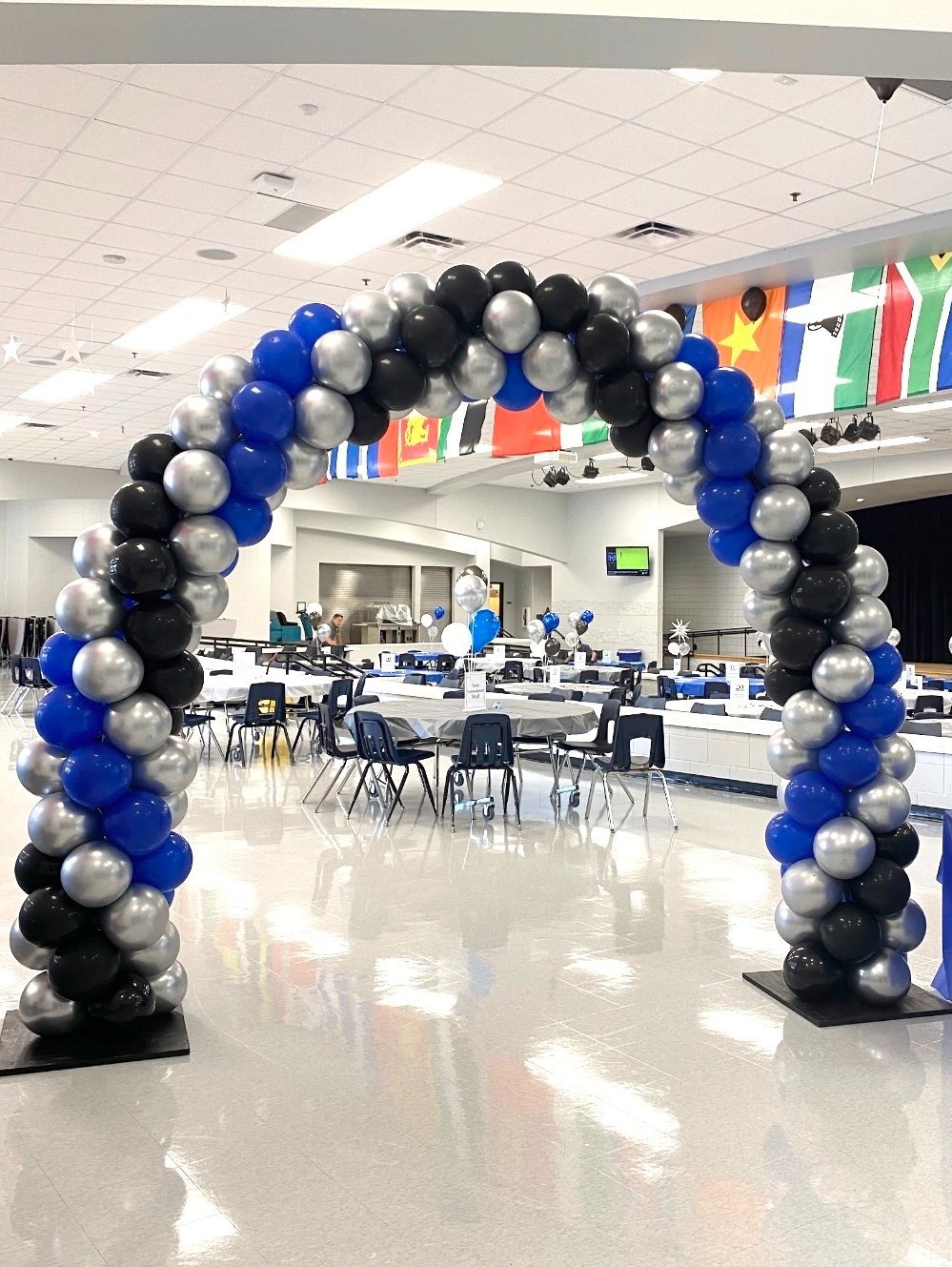  Classic balloon arch in school cafeteria welcoming teachers back. 