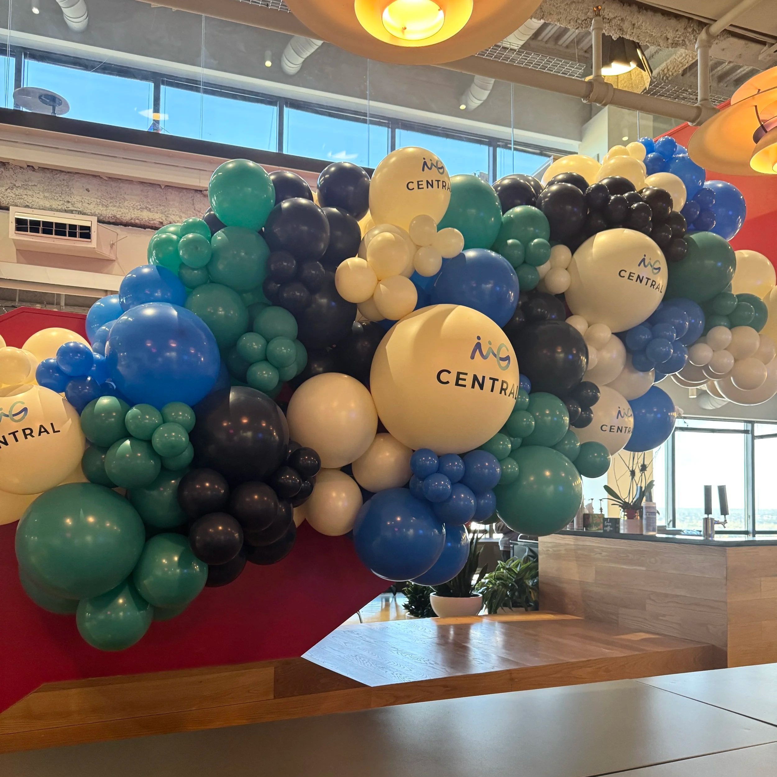Balloons in brand colors accented with logos
