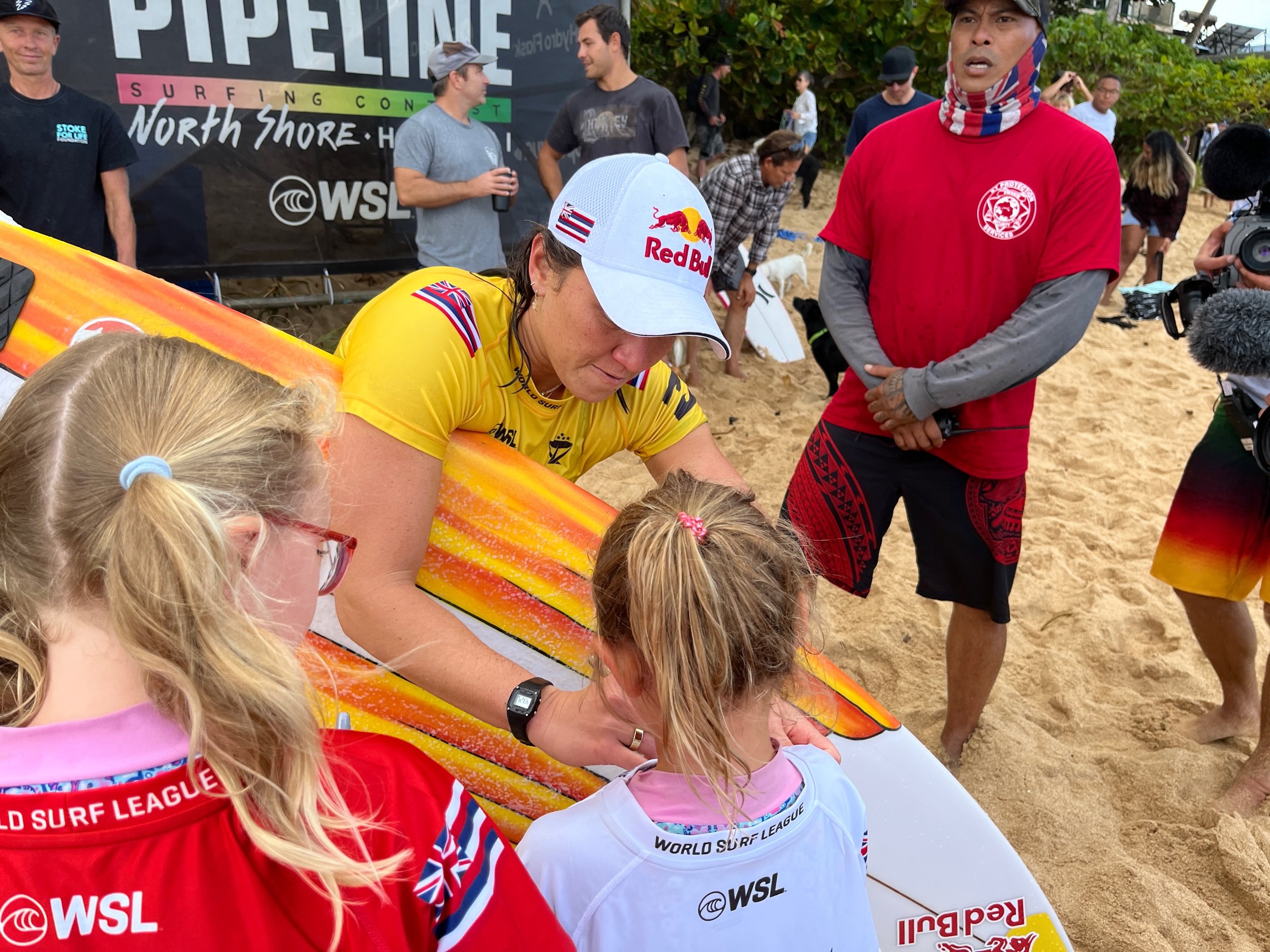 Carissa Moore signing Scarlett and Nora's tops