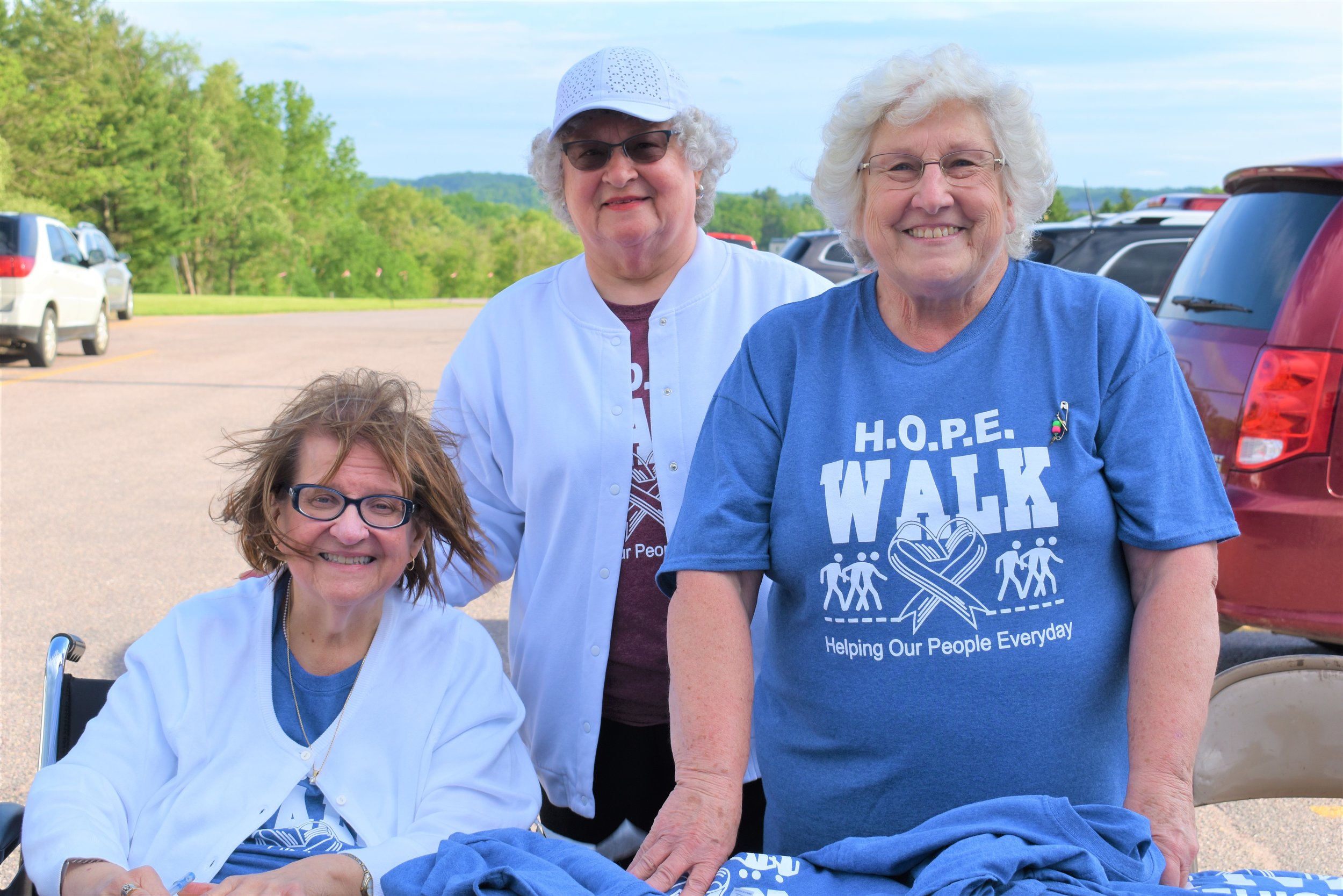  L to R- Connie Dorow, Shirley Richardson, and Jean Hora issuing T-Shirts 