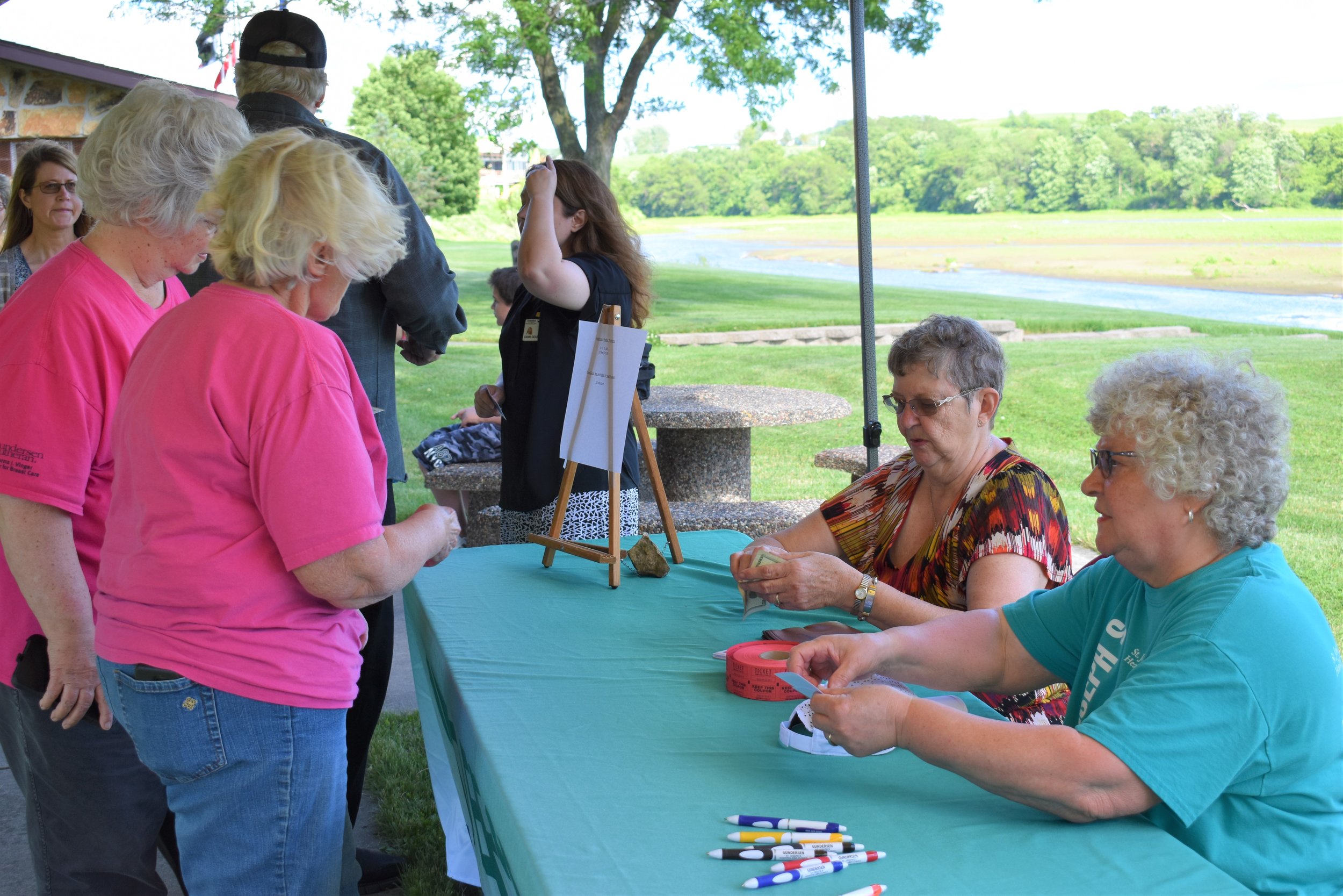T the table L to R June Hooker and Shirley Richardson selling Tea Party tickets.