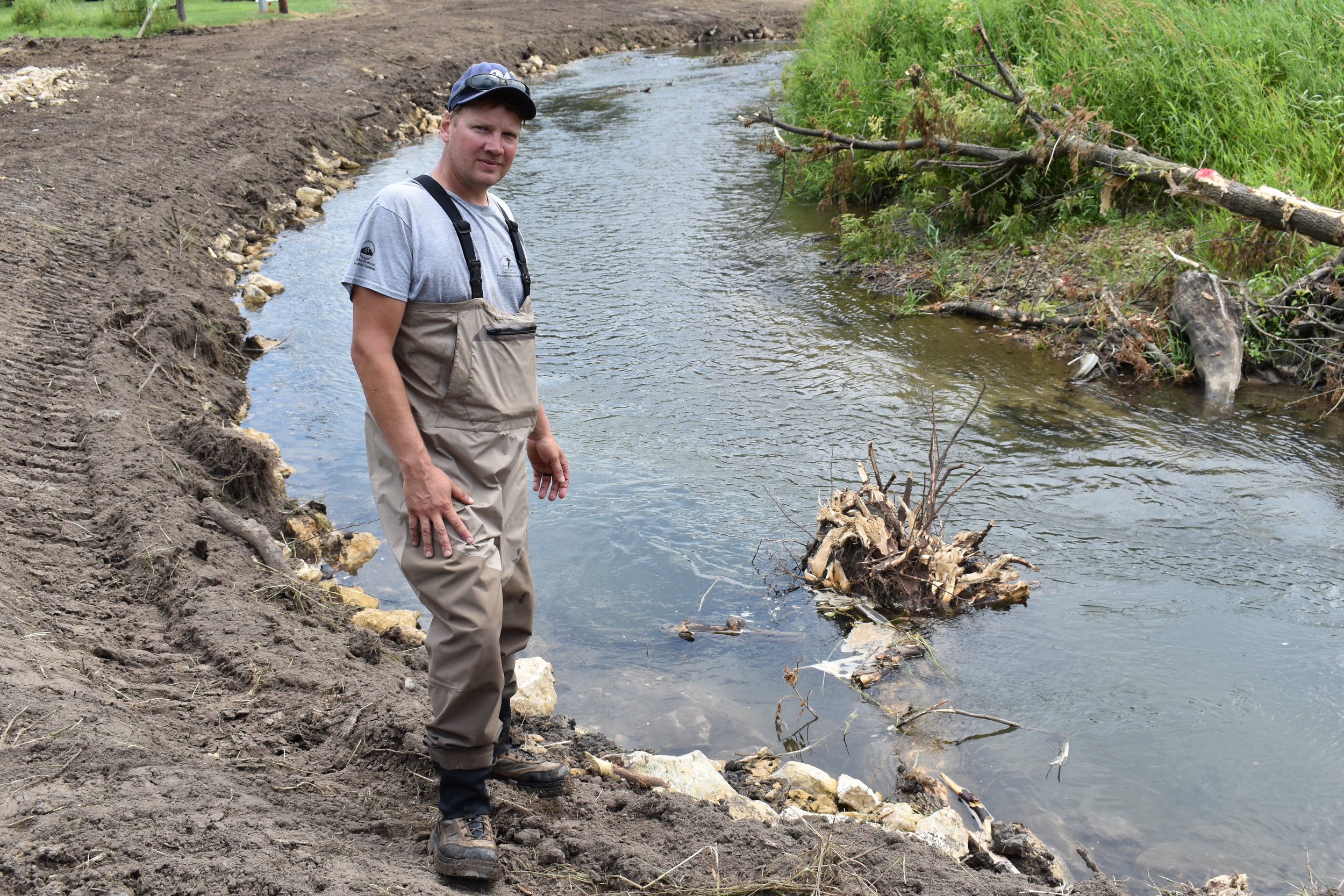  Matt Albright stands next to one of the root balls that were placed 