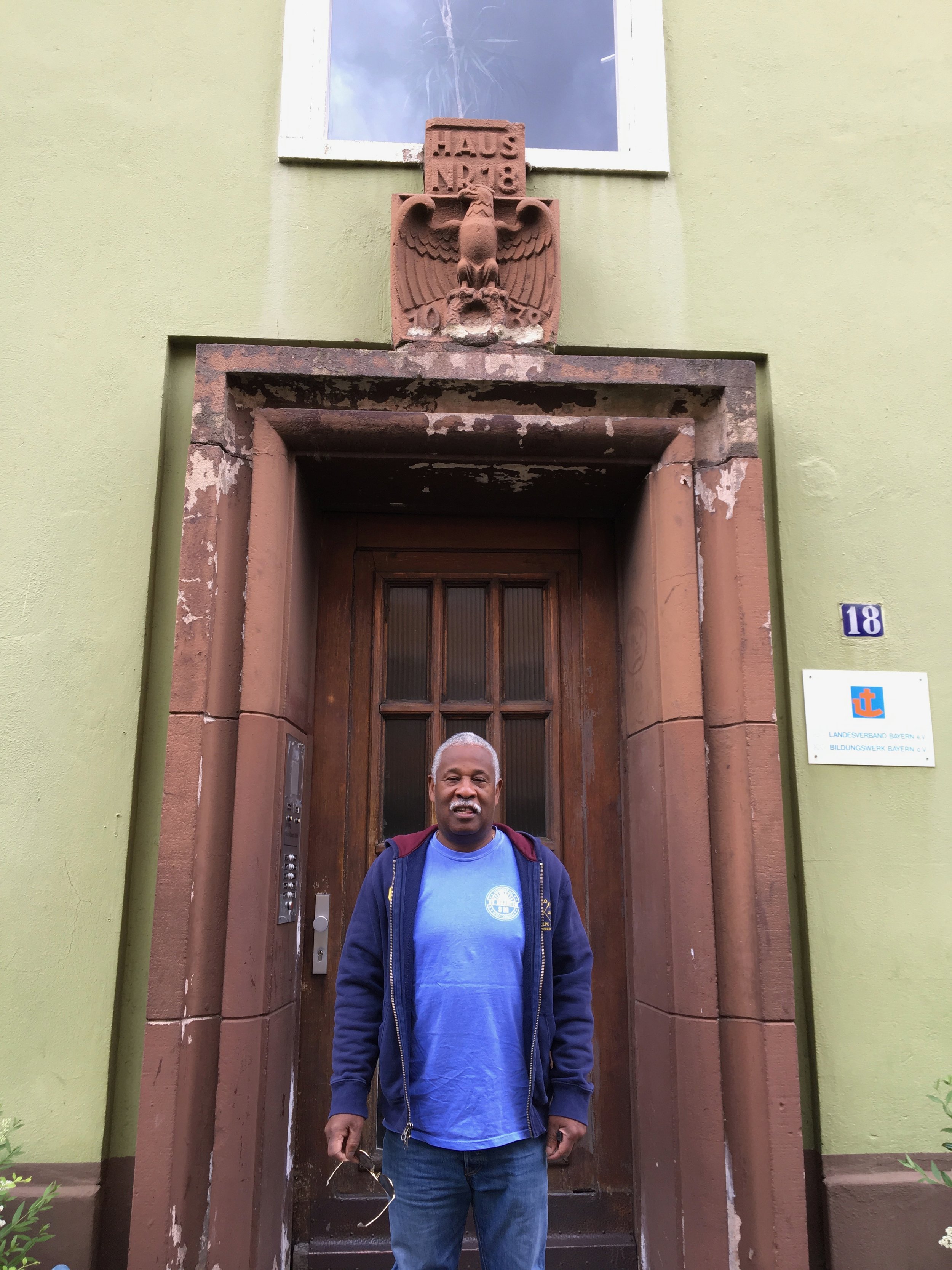 Tyrone Wylie Note Nazi-era swastica chiseled from above the entrance to his apartment building
