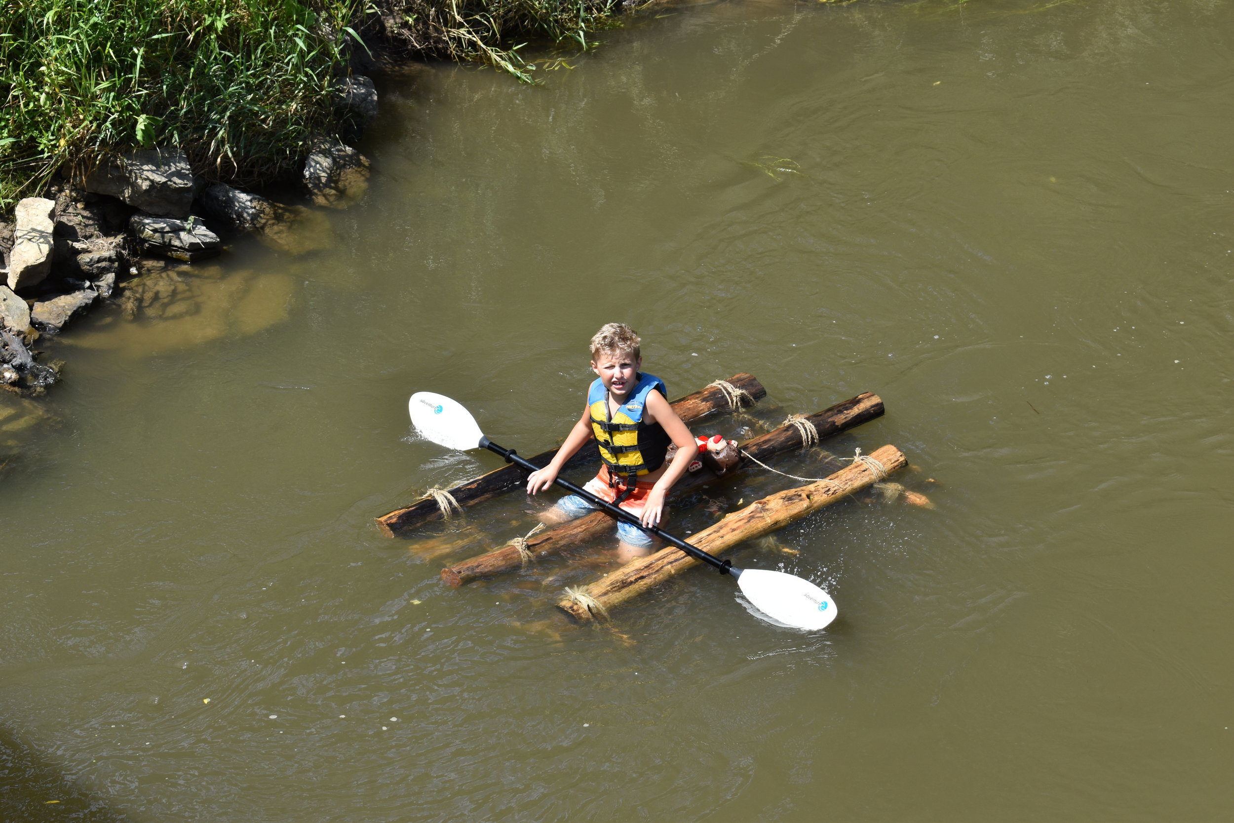  Hixson Katz finishing in first place, his brother not far behind in a canoe 