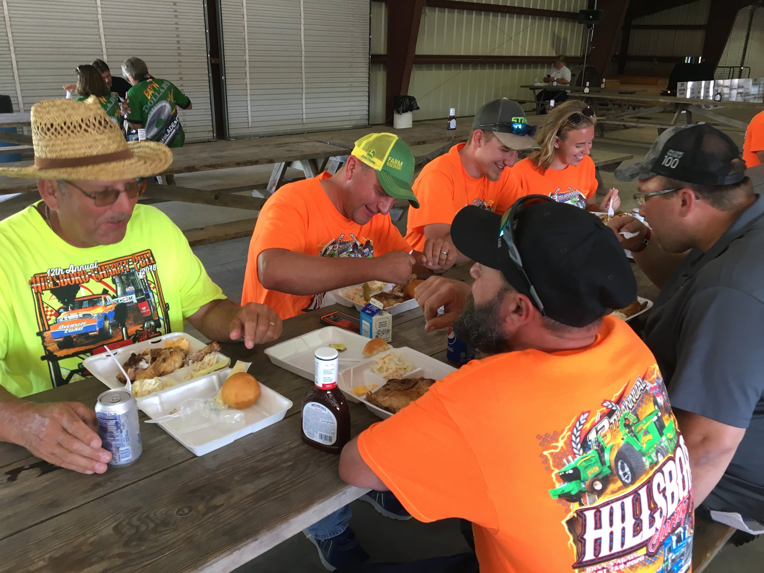 A few of the many volunteers from Hillsboro Equipment, Inc. chowing down