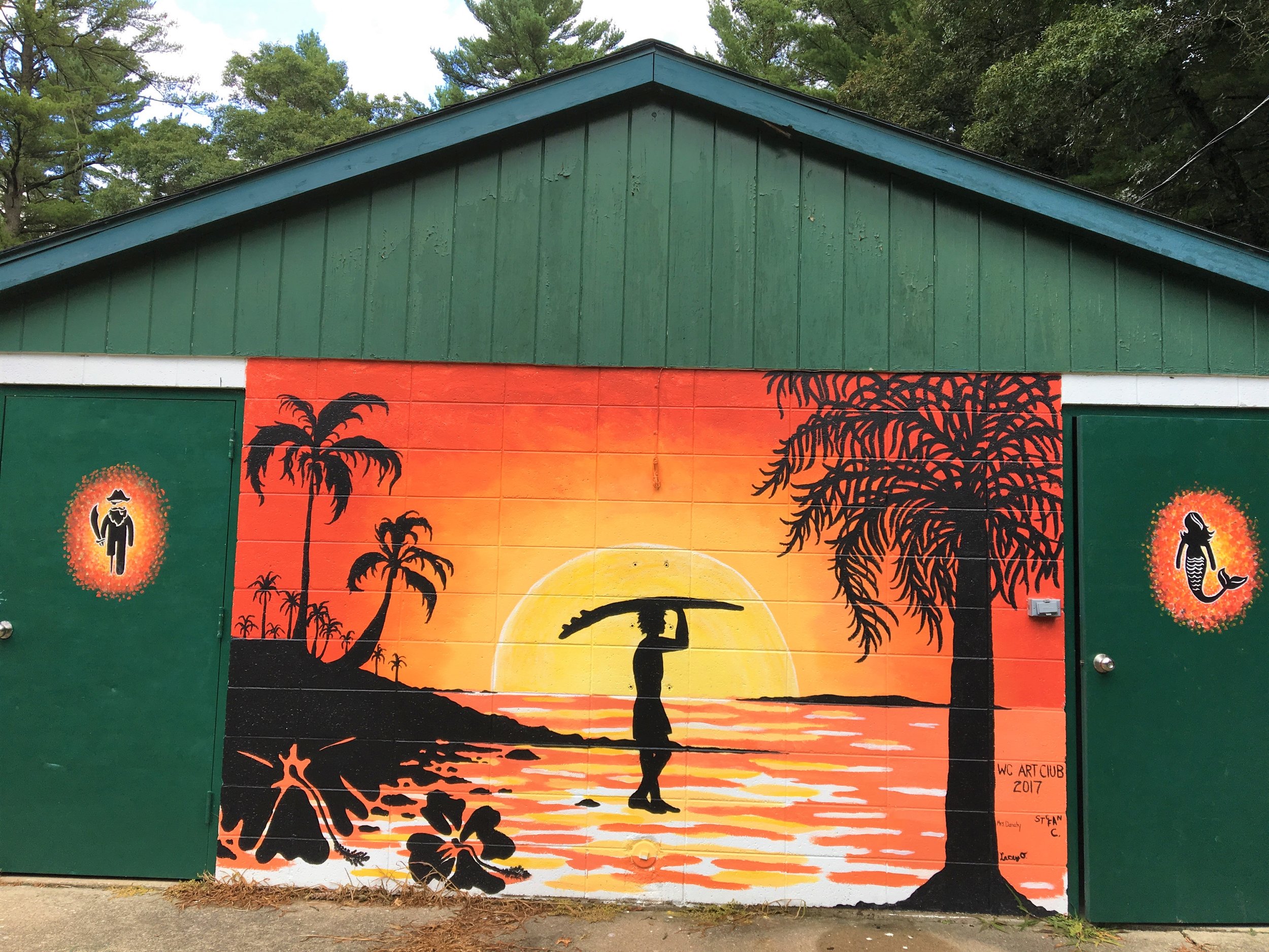   This beach scene painting at the Wonewoc swimming pool impressed Bill Huebel , leading him to contact its creator, art teacher Megan Danahy at Wonewoc-Center Schools.  