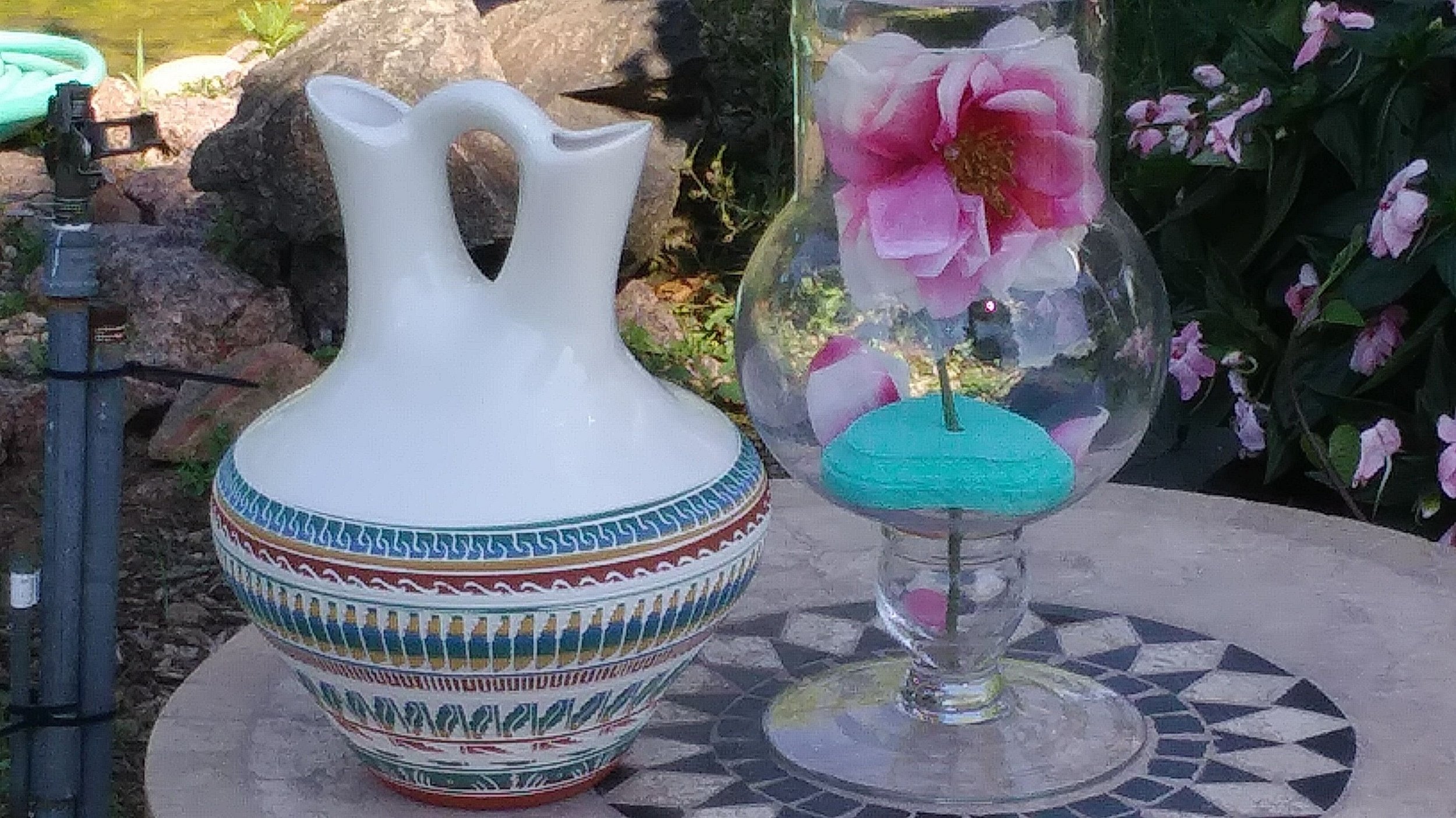 Our Dine wedding vase on the left, to the right our wedding rose Amanda made for our Beauty and the Beast theme