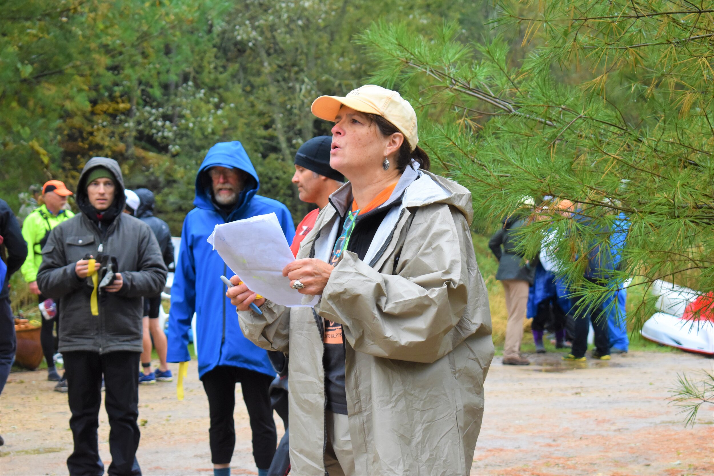 Volunteer Mary Lynn Dombroski reading the race rules and cautions to the competitors.
