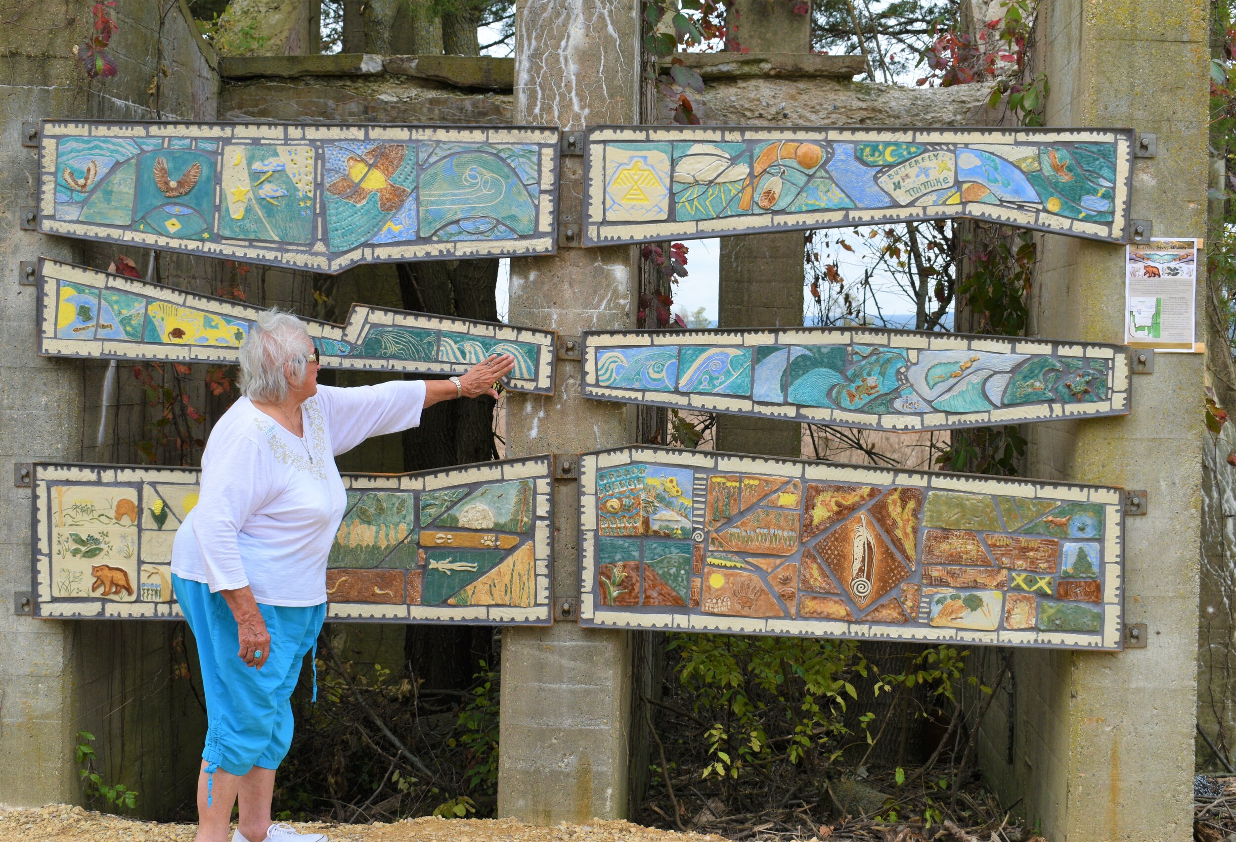  Hoocąk (Ho-Chunk) elder Connie Lonetree admiring the work of many families that contributed to the mural. 
