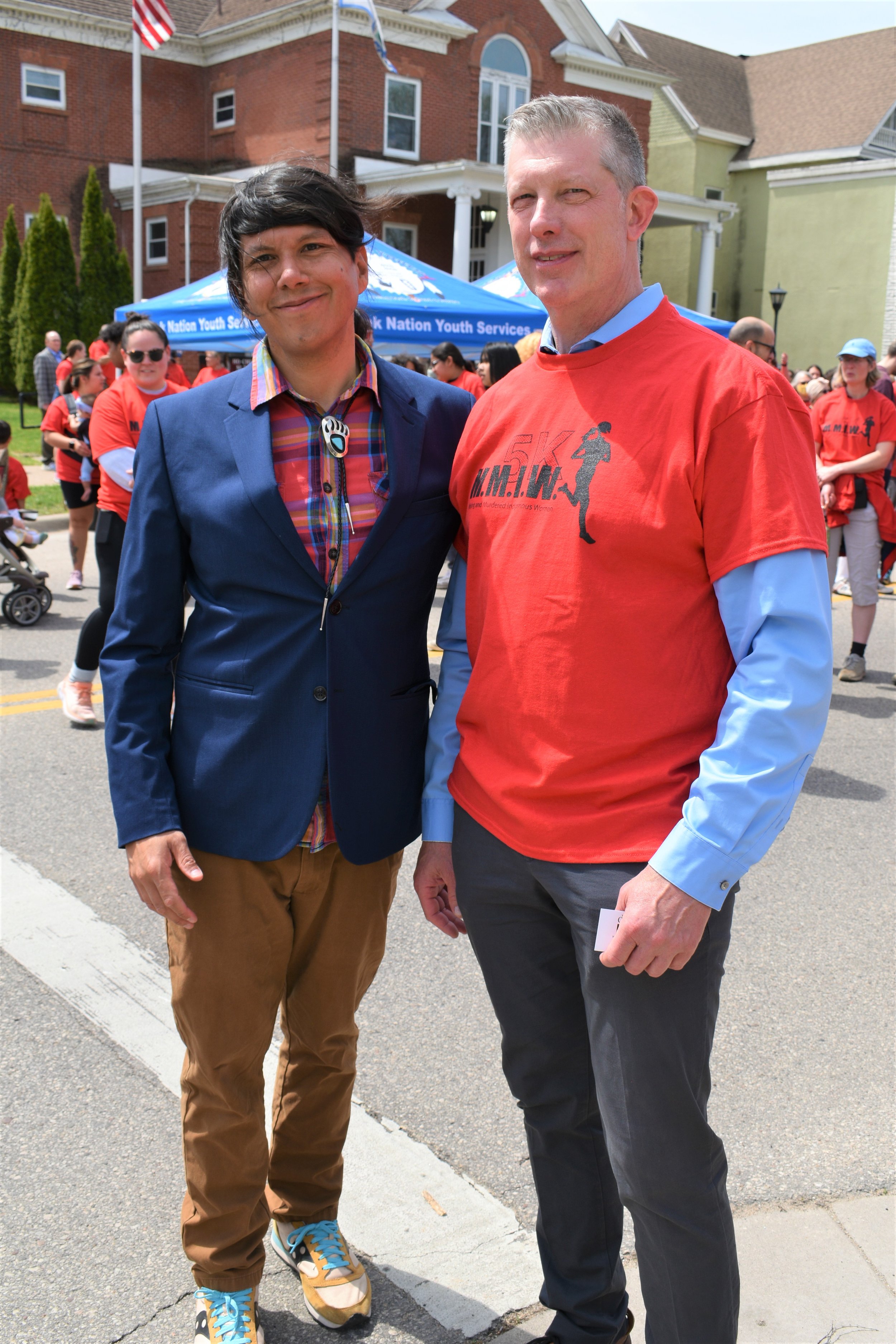  Left, Hoocąk Public Relations Officer Casey Brown poses before he run/walk with LaCrosse Mayor Mitch Reynolds. 