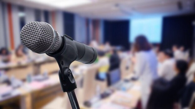 microphone-blurred-business-forum-meeting-conference_34102-261.jpg