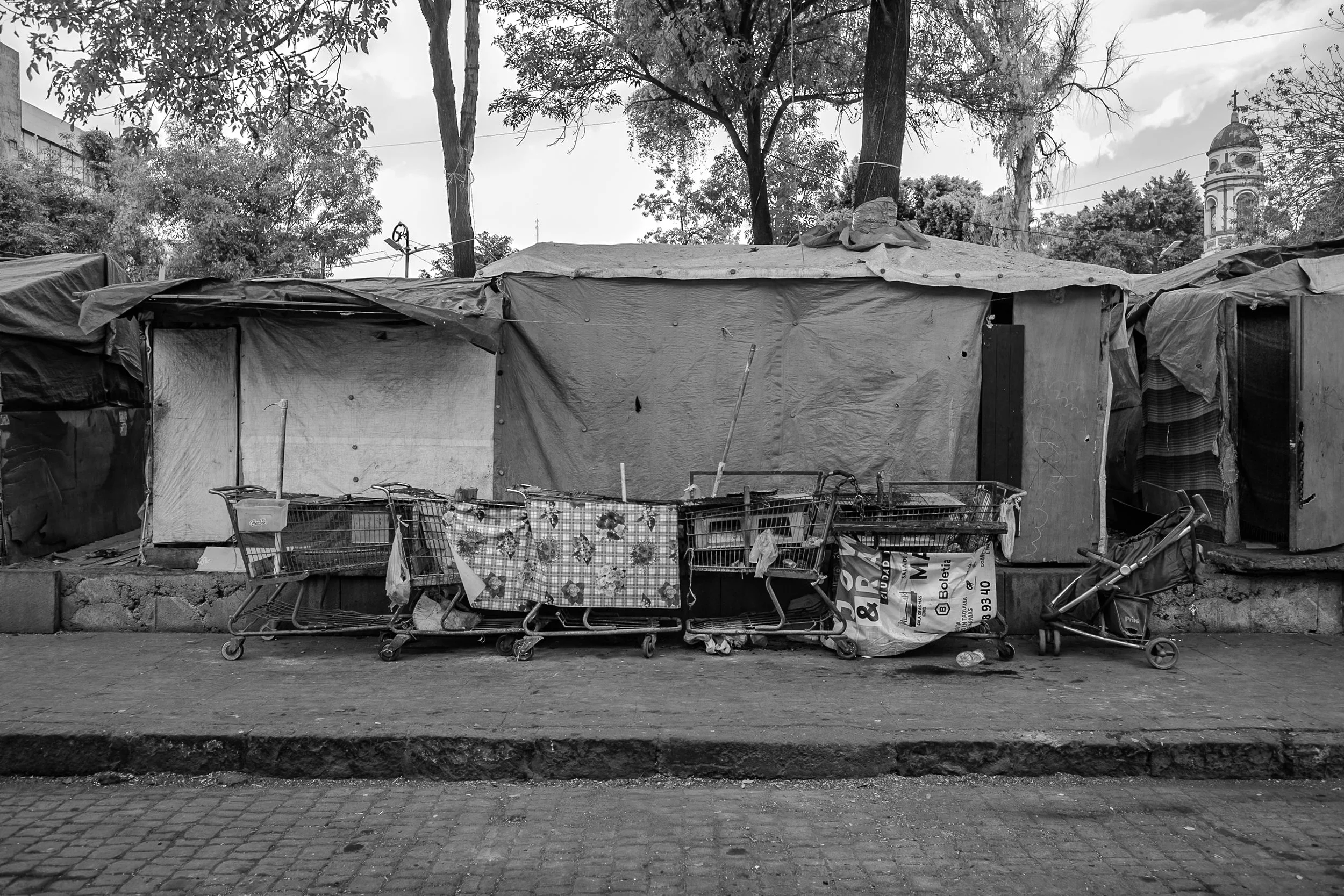 Children under the age of 15 make up one third of the population in the camp. Shelters are constructed from cardboard and plastic sheeting. 