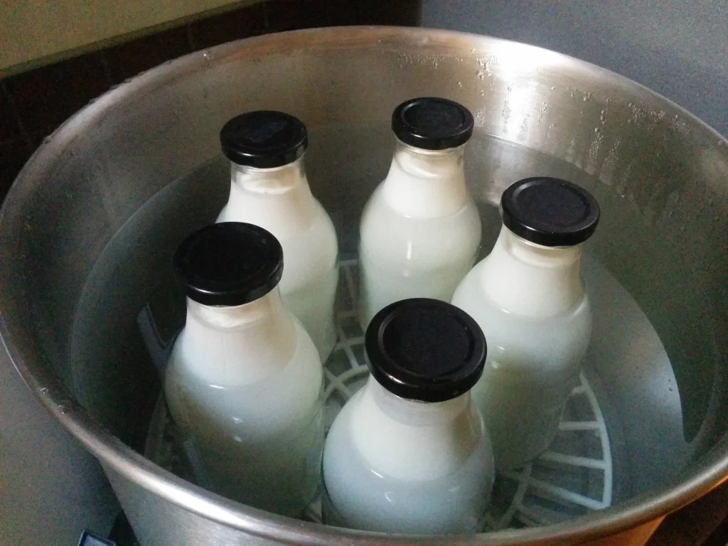 
Milk in the pasteuriser and about to jar up the yogurt  