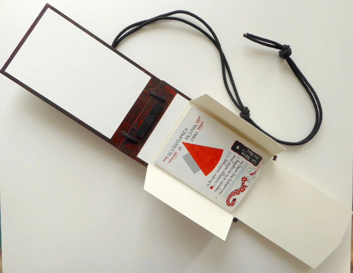 book covers open, book folded within